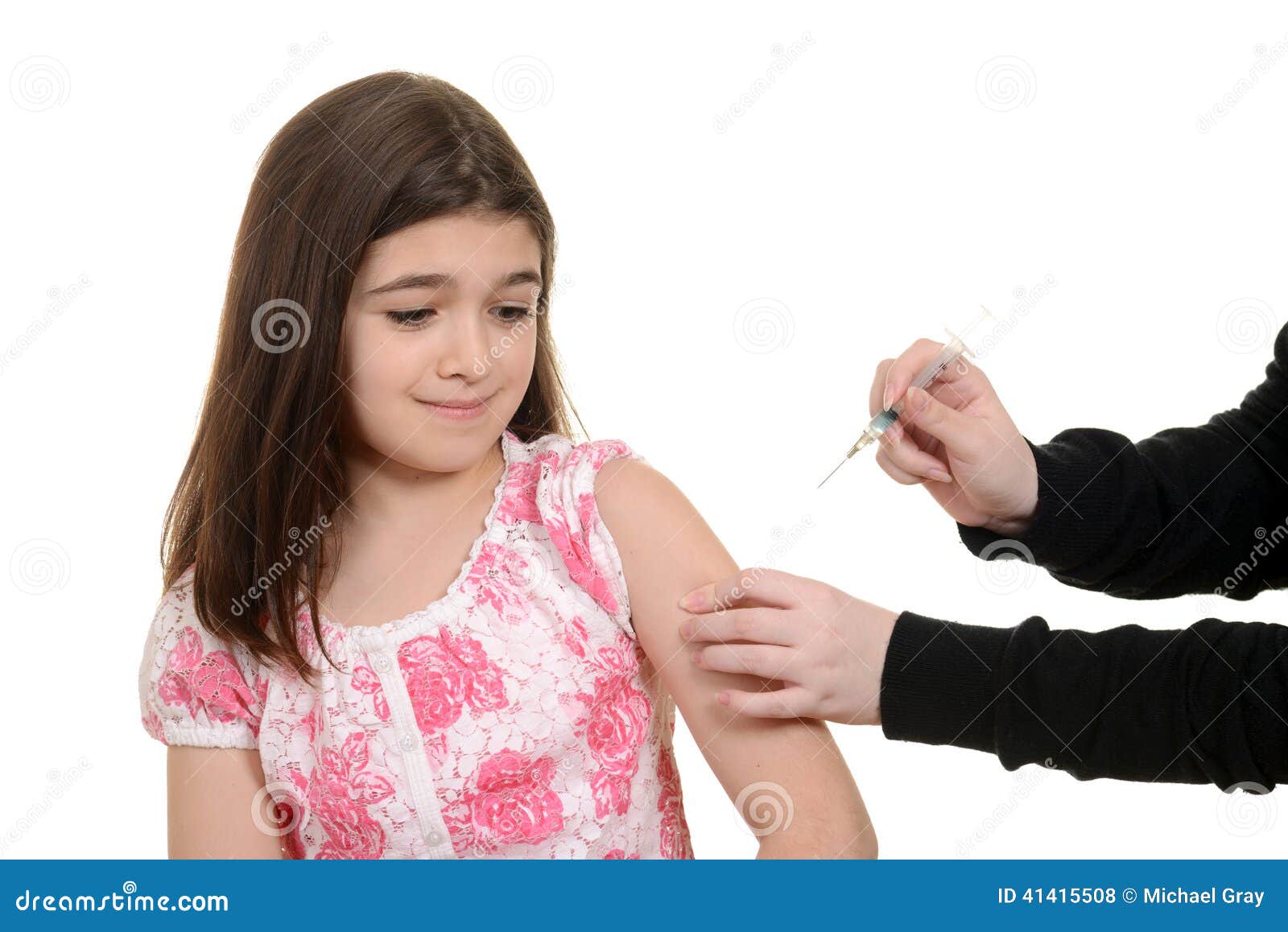 scared child getting immunization injection