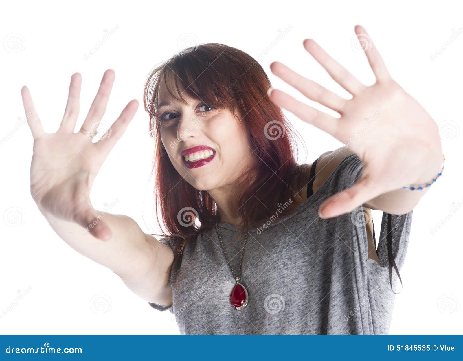 scared woman making stop gesture sign on hands