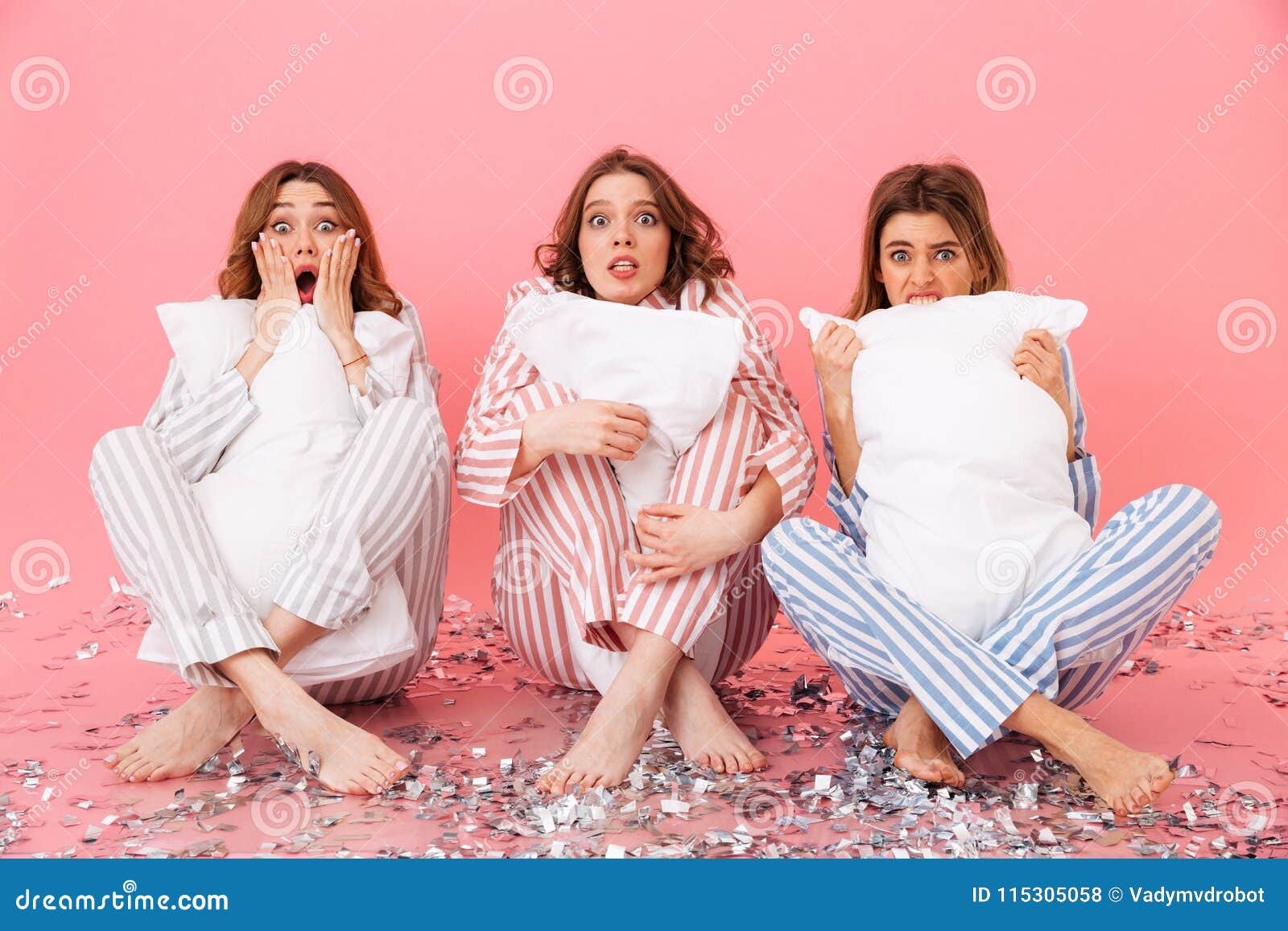 Scared Women Friends Wearing Leisure Clothing Holding Pillows. Stock ...