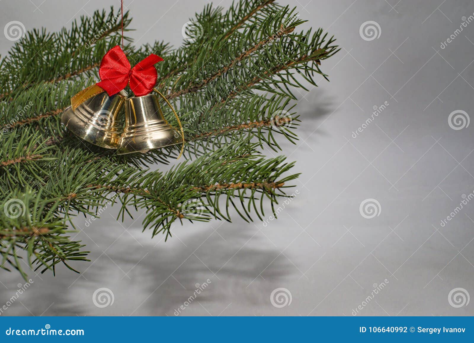 Jingle Bells with Red Bow and Christmas Tree. Stock Photo - Image of ...