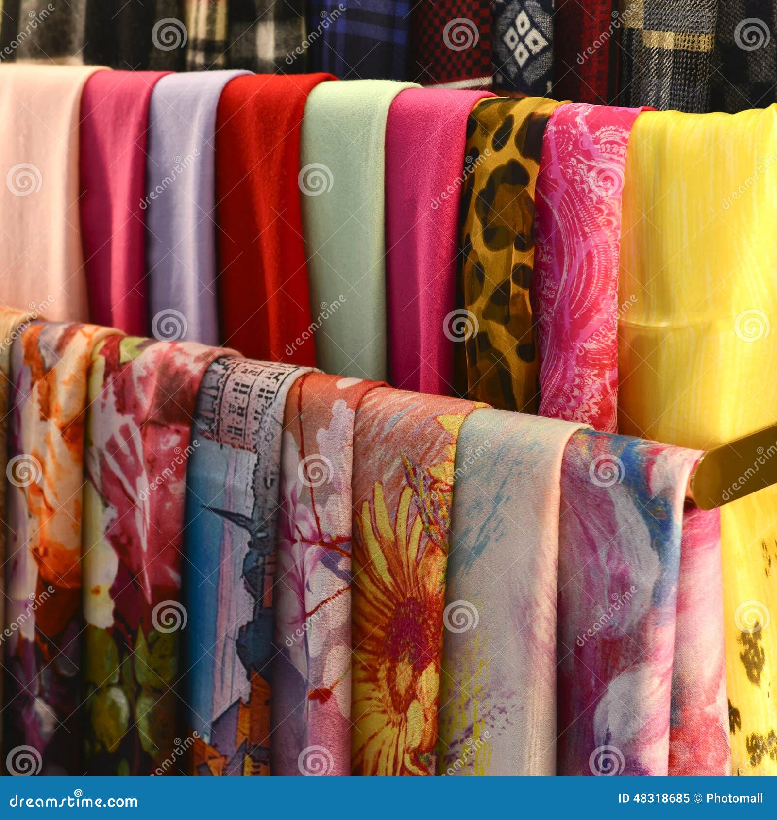 scarves on racks in fashion store,close up