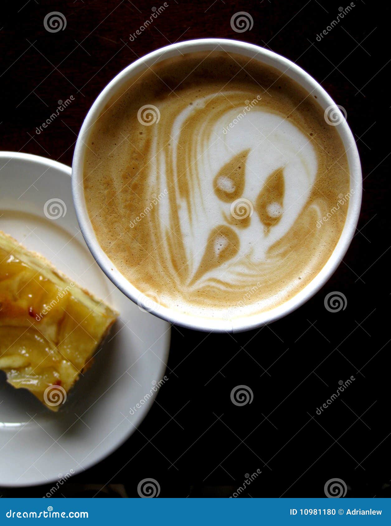 scary face on frothy coffee