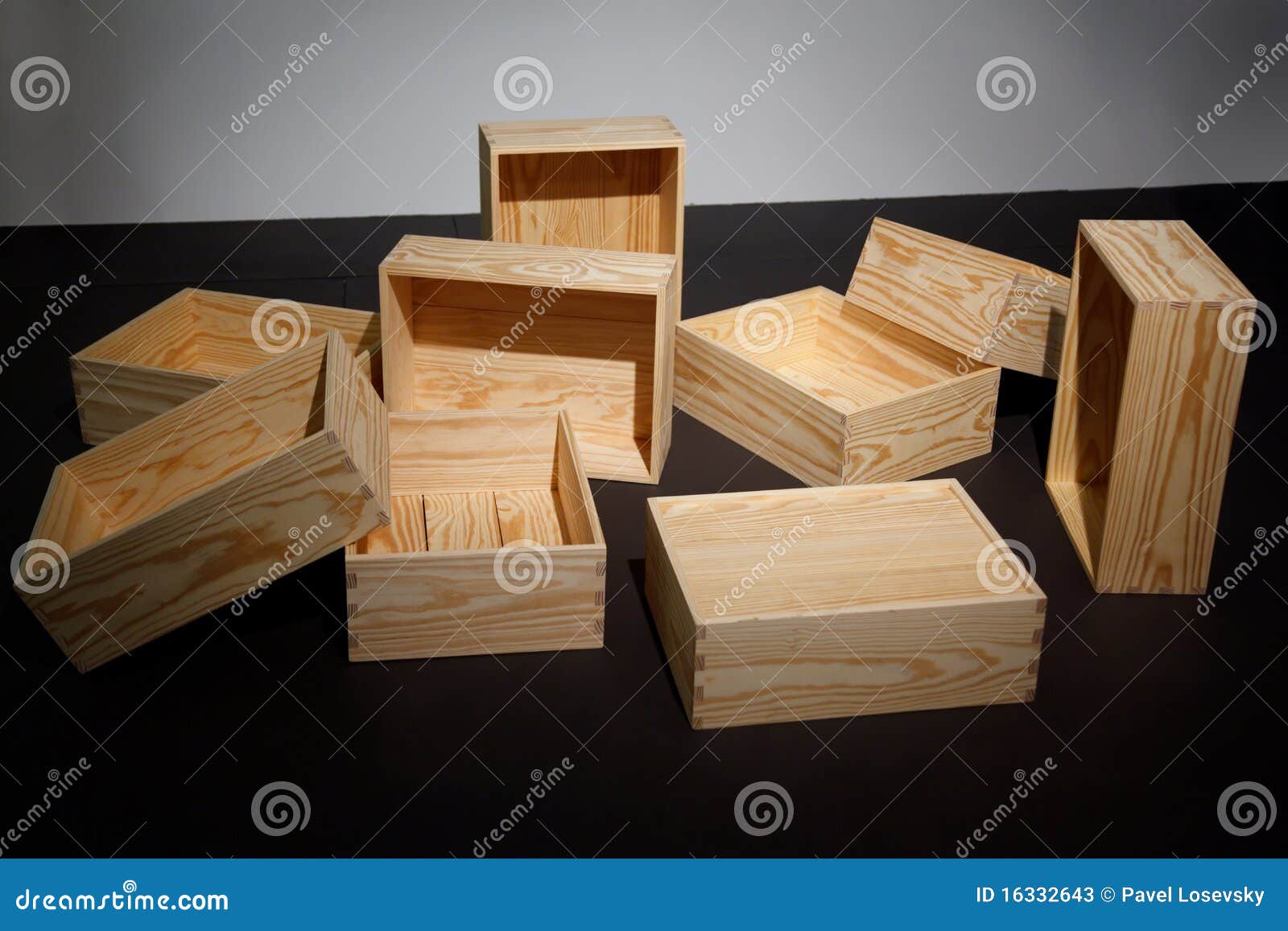scattered empty wooden boxes on floor.