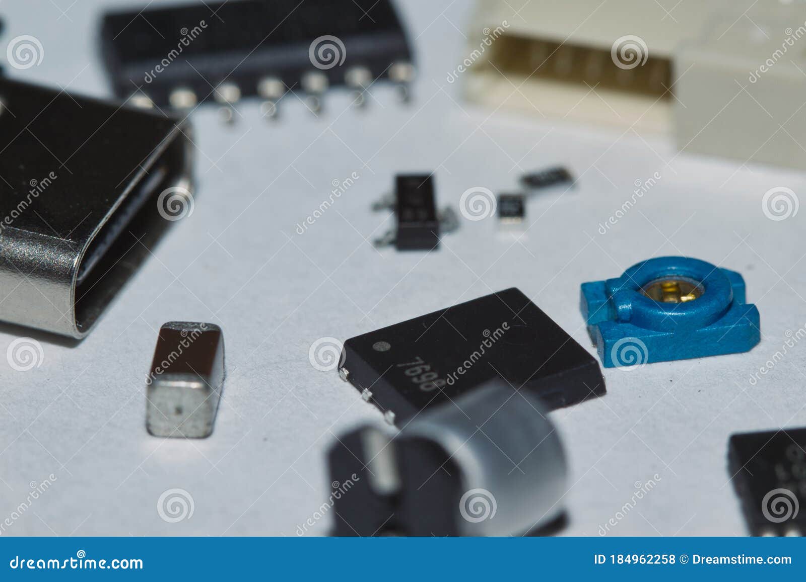scattered smt components on white background