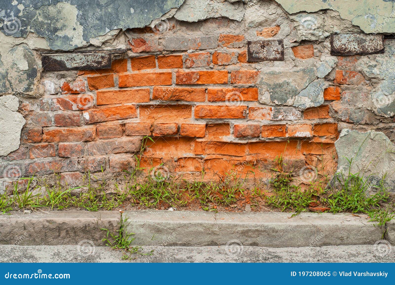 Scattering of Plaster from the Wall of an Old House. Bright Bricks