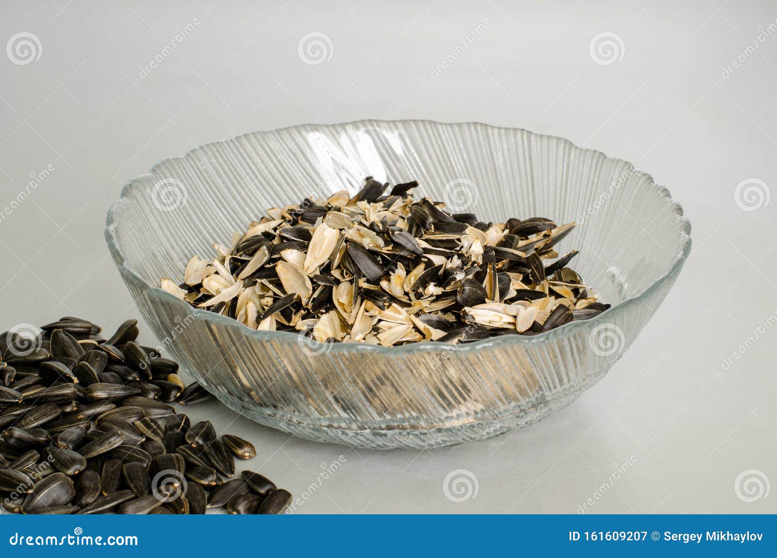 A Scattering of Sunflower Seeds. a Transparent Plate with Husks Stock