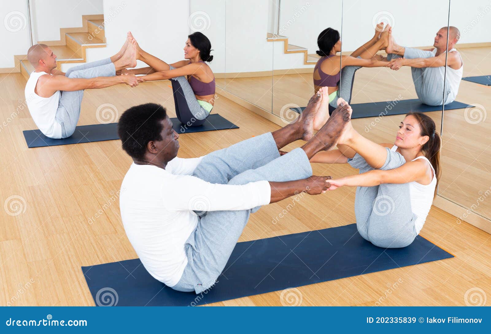 Scene of a Group of People Practicing Couples Yoga Stock Image Image