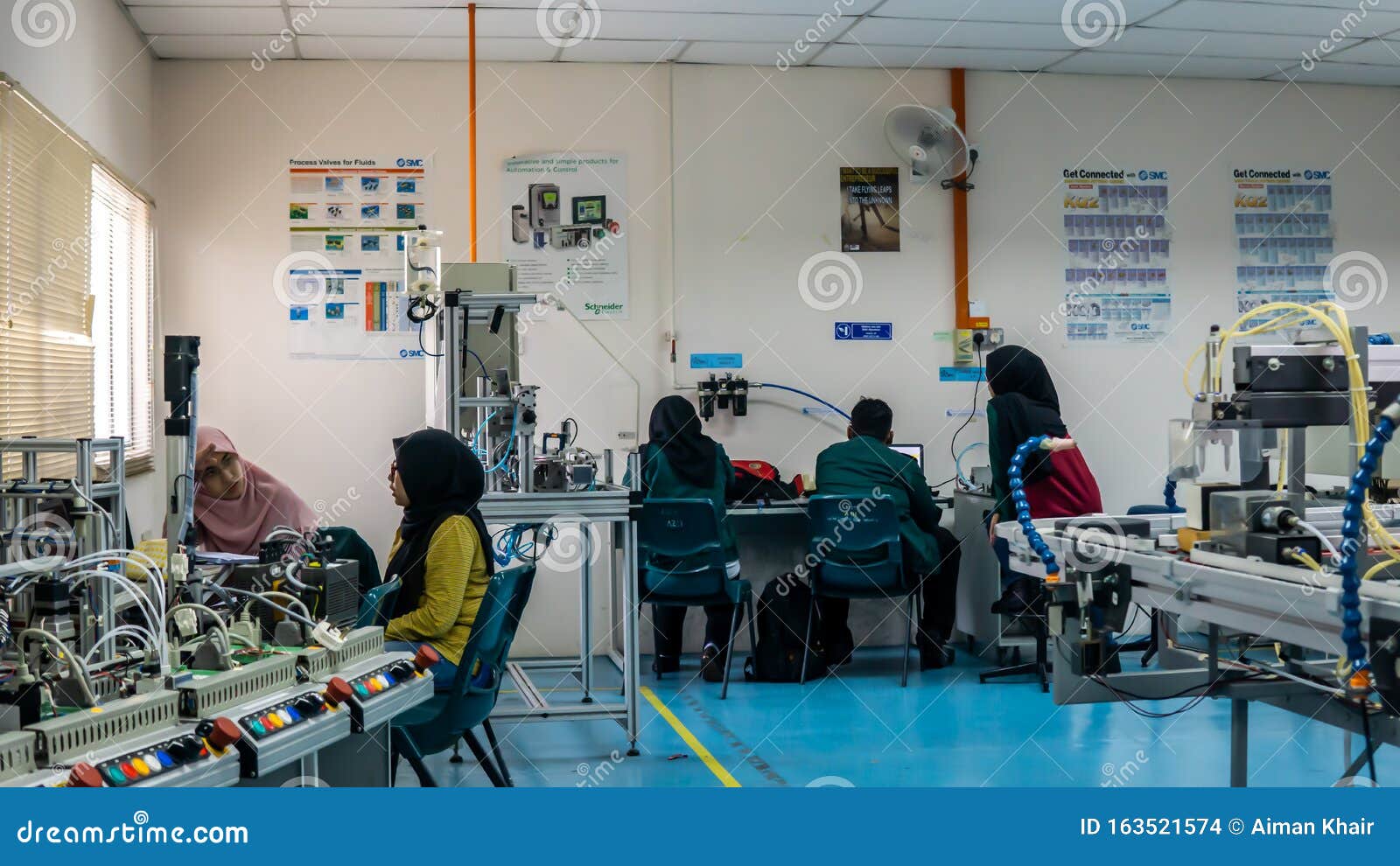 The Scene in the Industrial Machinery Laboratory. Engineering Students