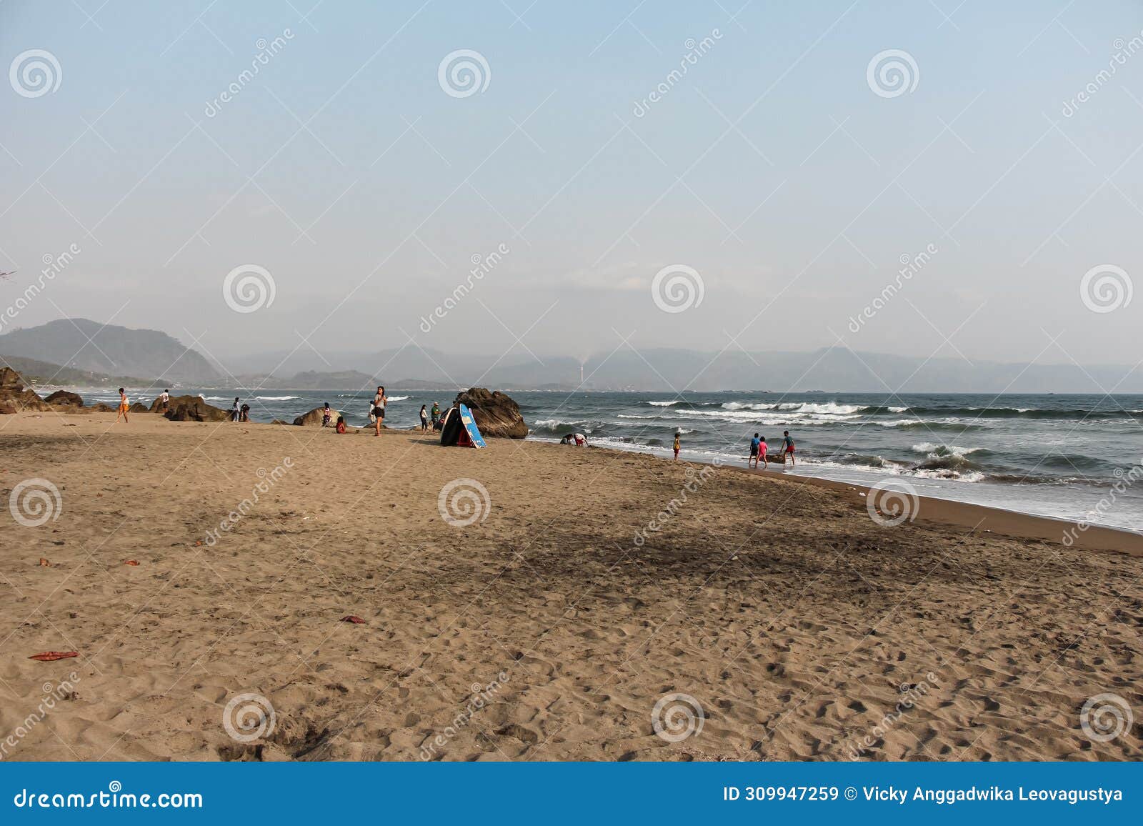 scenery of a stretch of brownish sand on a beach in the sukabumi area