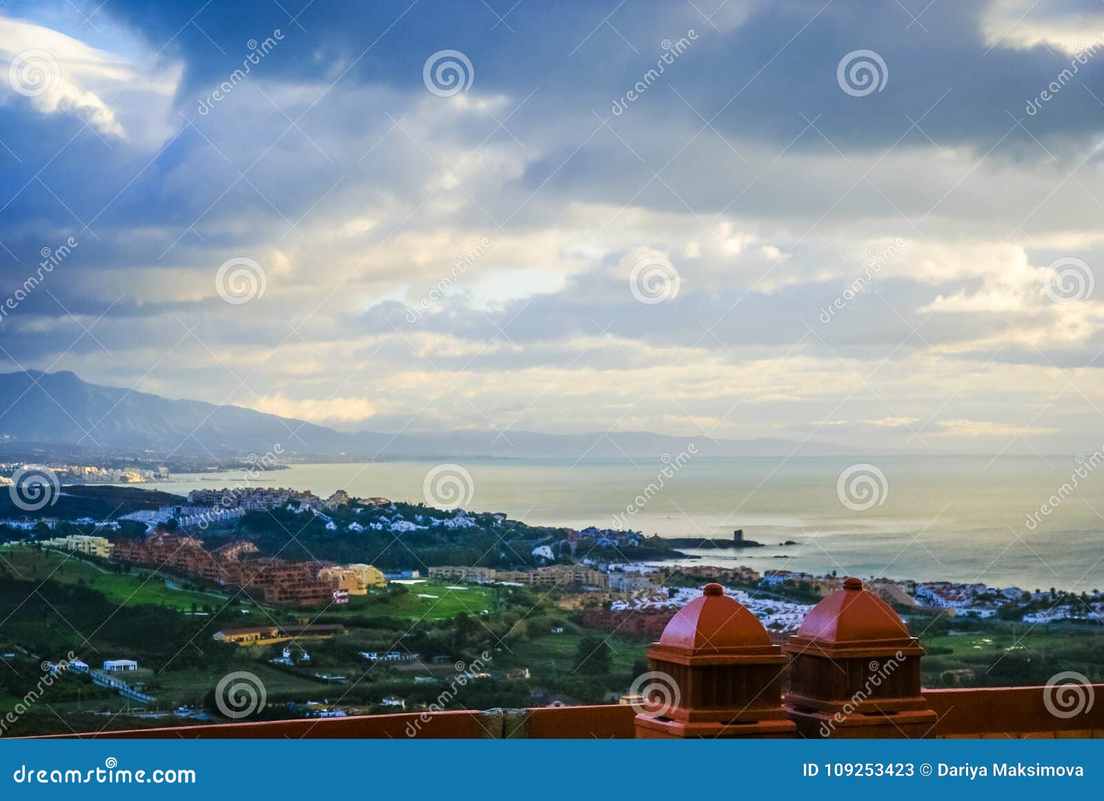 cloudy view to manilva from hill in spain