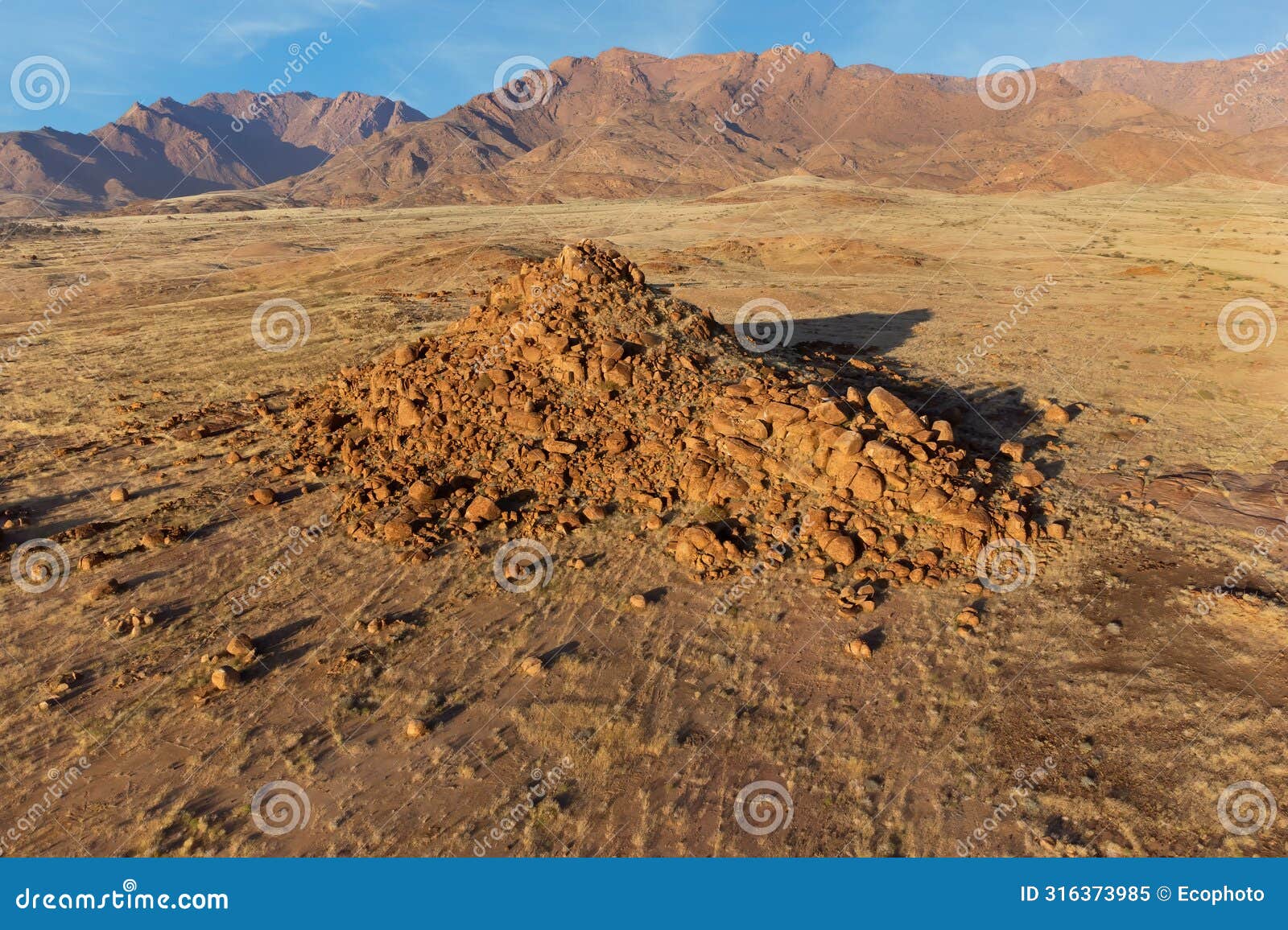desert landscape with rocks and arid grassland, brandberg mountain, namibia