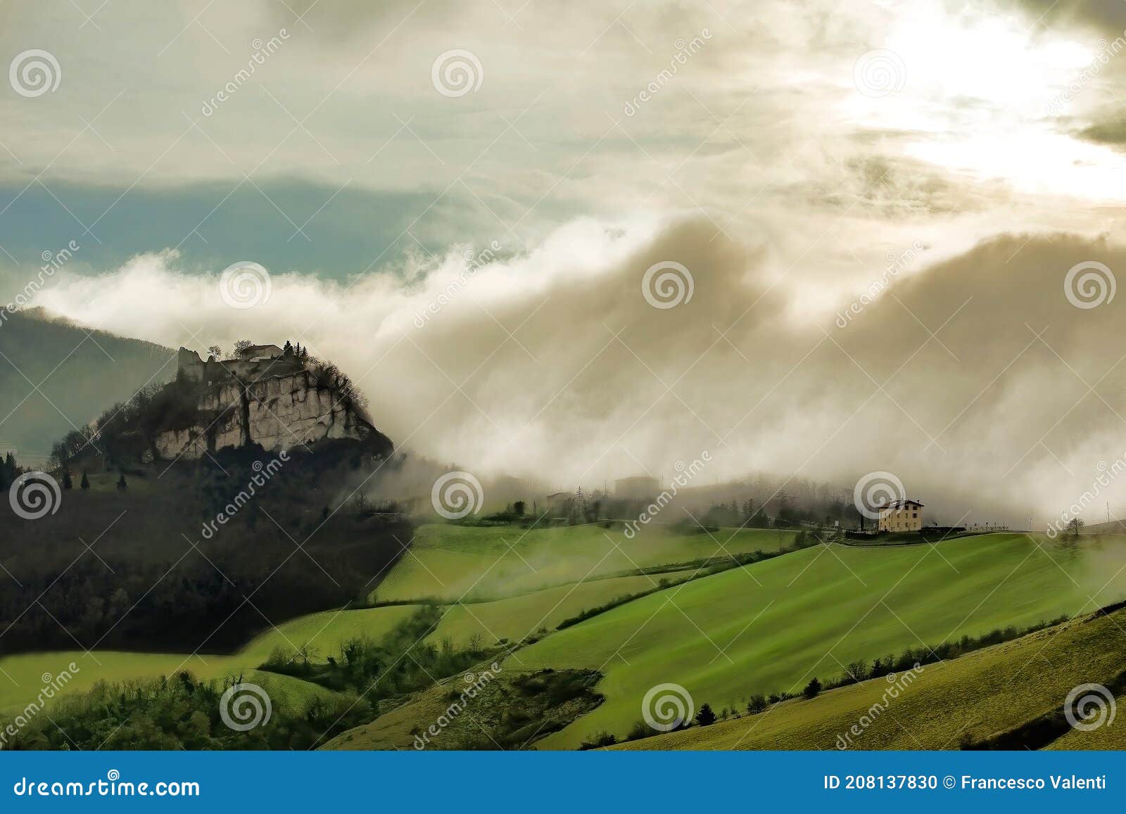 scenic fog coming on italian hills and canossa castle, emilia romagna