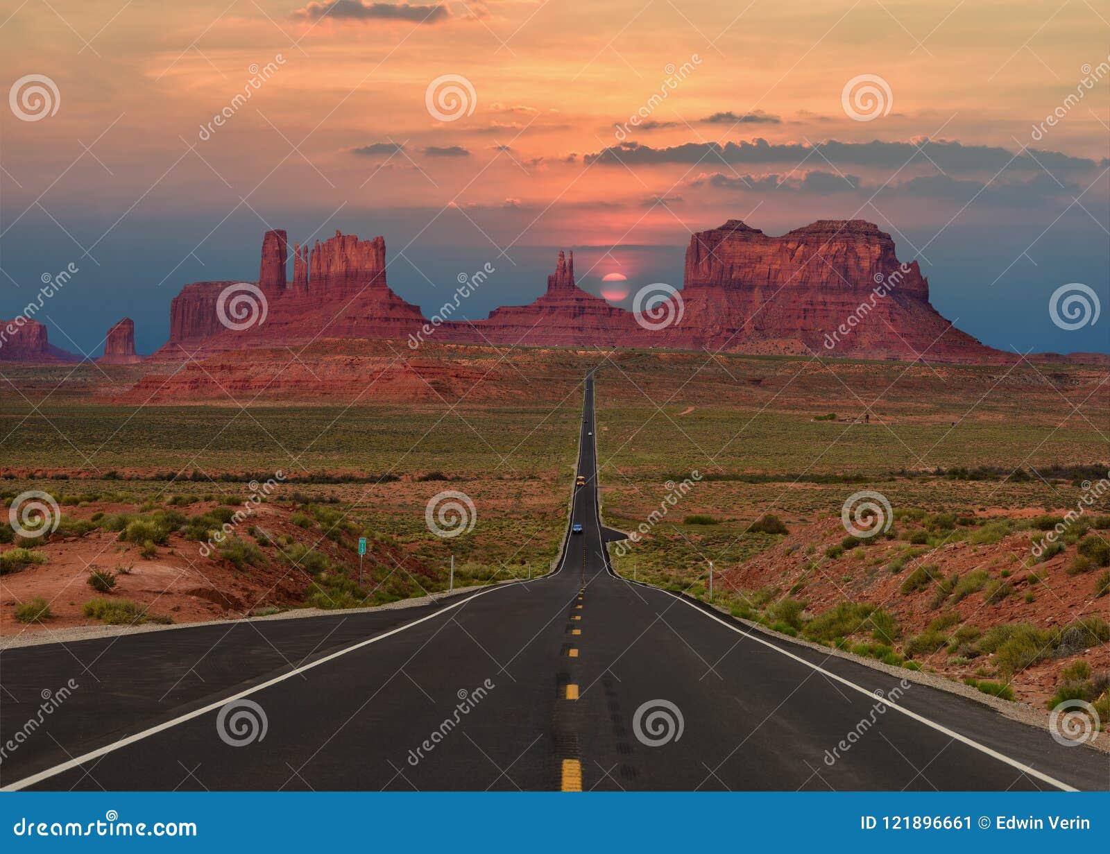 scenic highway in monument valley tribal park in arizona-utah border, u.s.a. at sunset.
