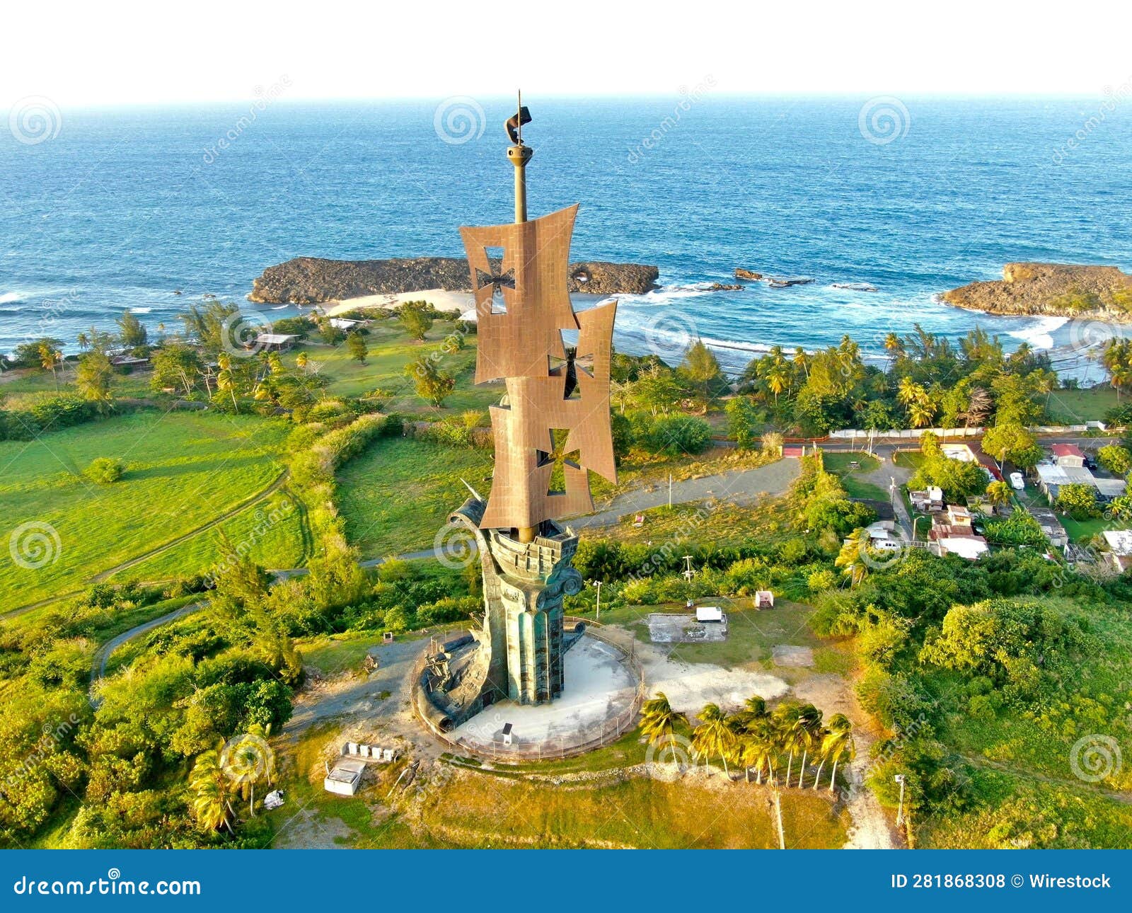scenic image of the statue of columbus, surrounded by lush green vegetation in arecibo, puerto rico