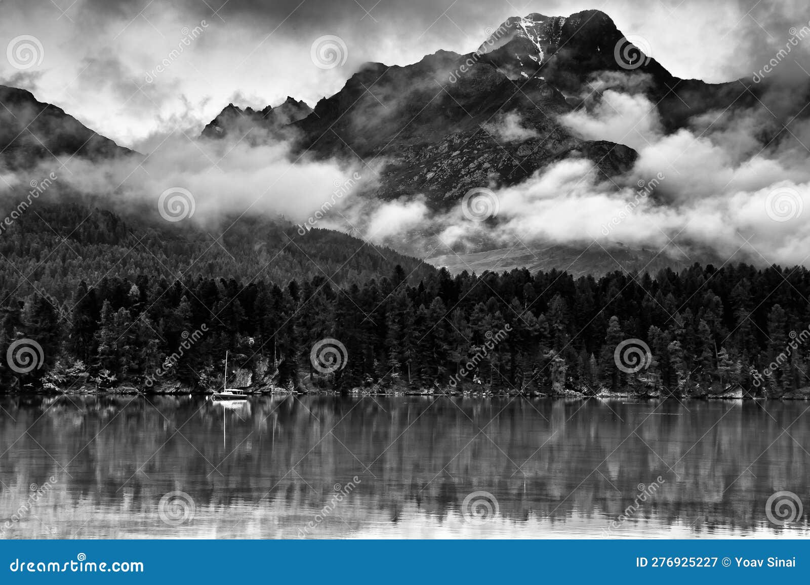 scenic landscape of low clouds of autumn and piz da la margna and lake of segl silsersee swiss