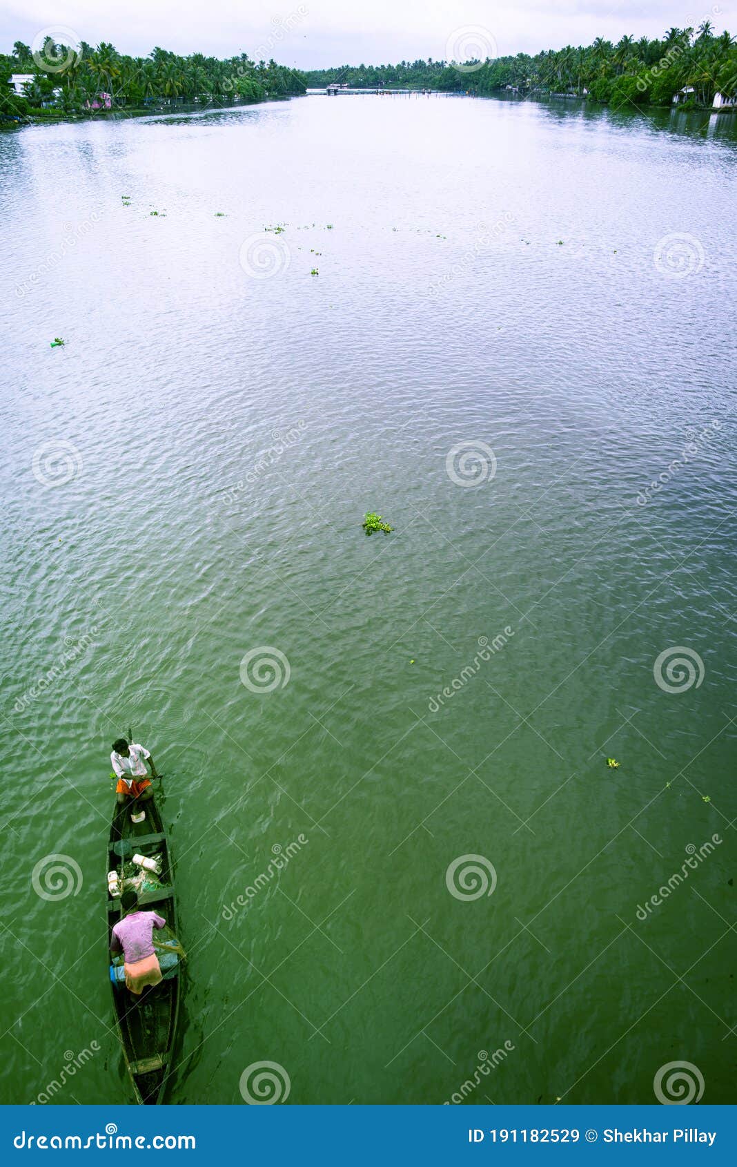 landscape view of mezzo fishing in middle of river