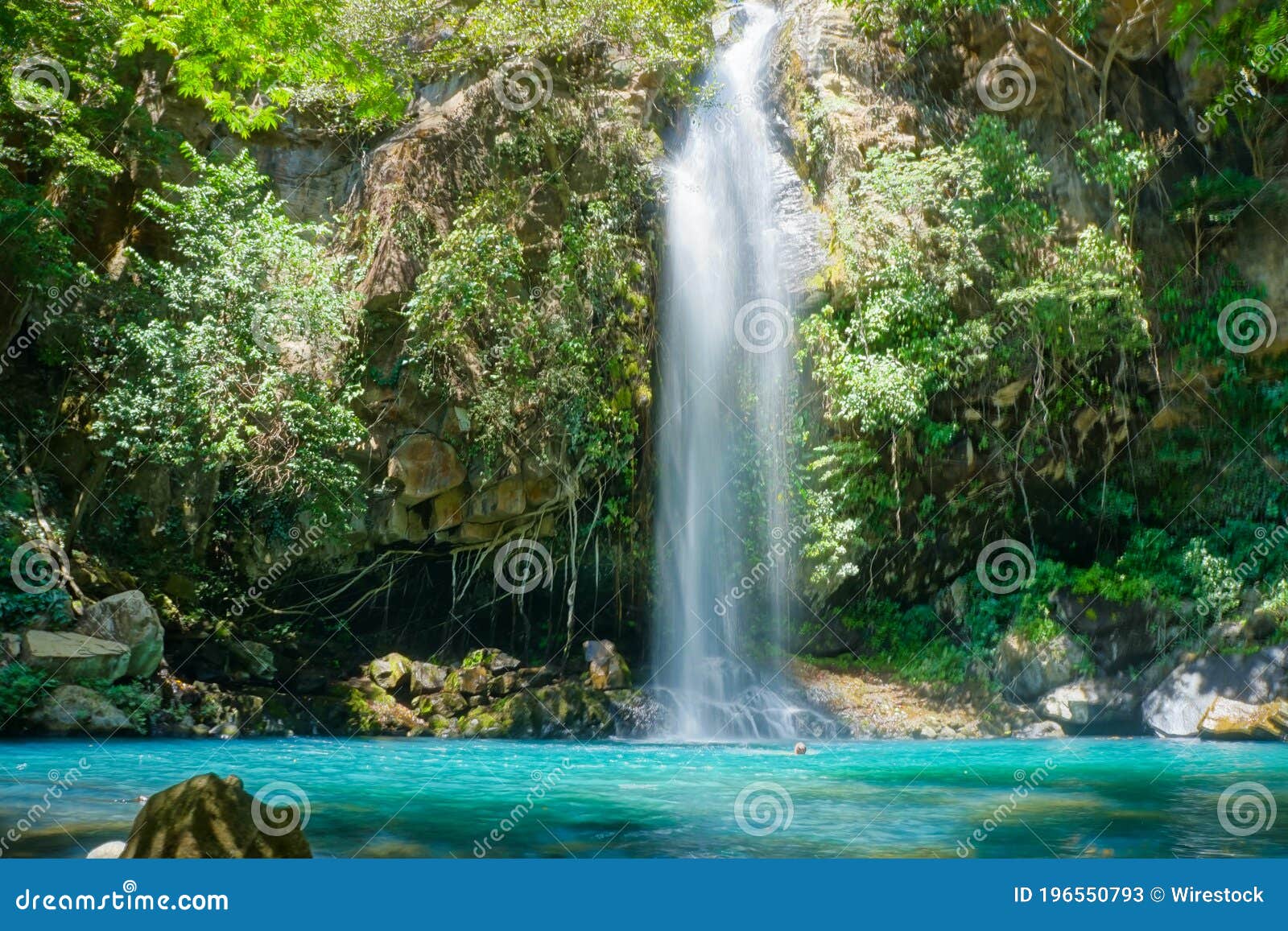 scenic low angle shot of a waterfall from rincon de la vieja volcano national park in costa rica