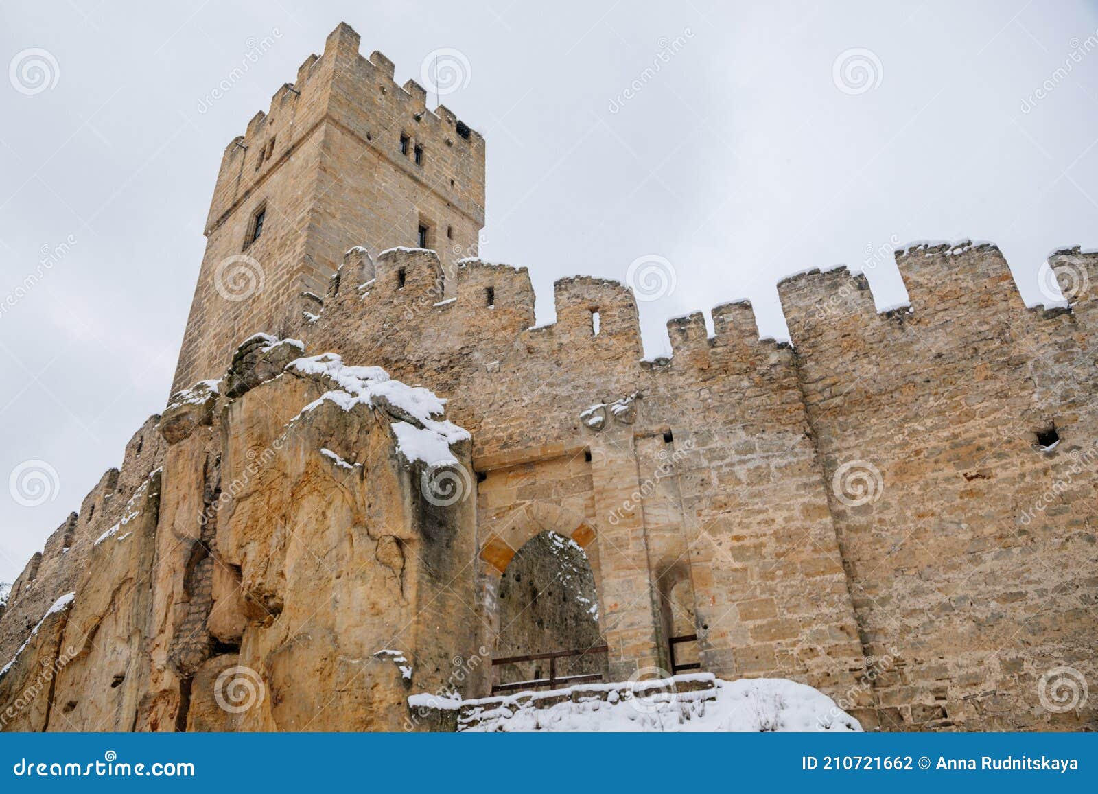 scenic view of ancient ruins of old gothic medieval castle helfenburk u usteka with stone tower under snow in winter day,