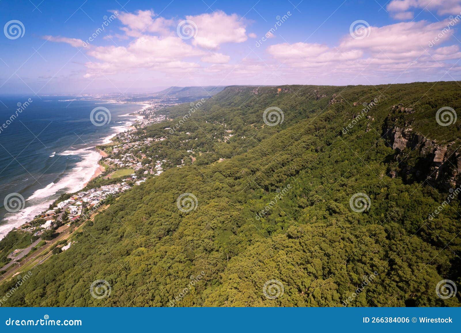 scenic view of coledale village on an evergreen hill on the coast of the ocean in australia