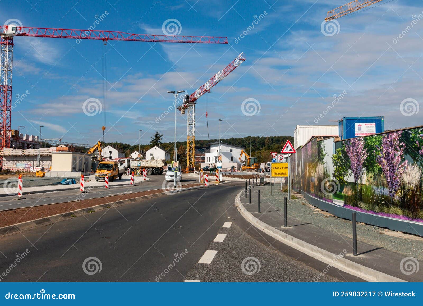 Scenic View of a Crane Working in a Construction Zone with a Cloudy Sky in the Background