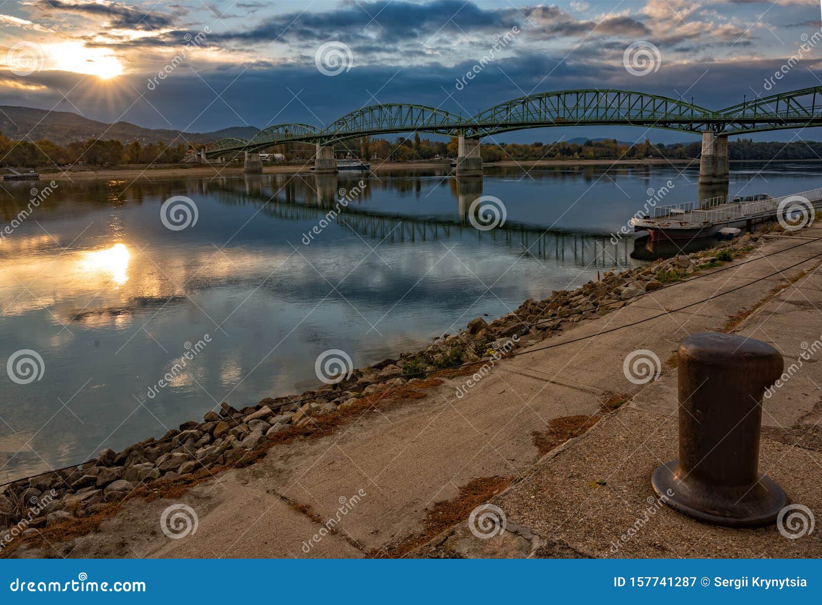 scenic view of maria valeria bridge with reflection in danube river, esztergom, hungary at sunrise