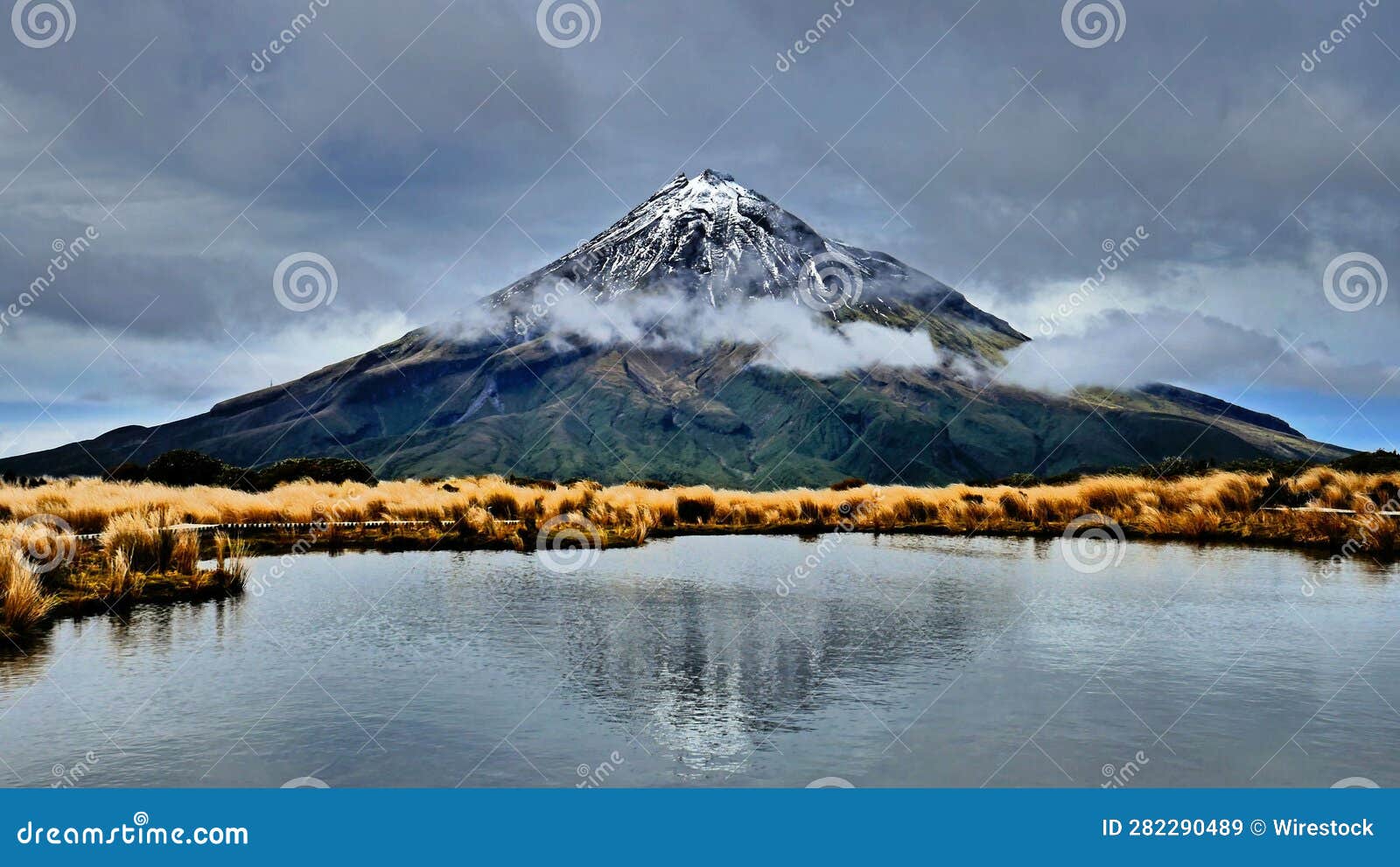 Scenic View of Mt Taranaki Reflecting in a Lake in New Zealand. Stock ...