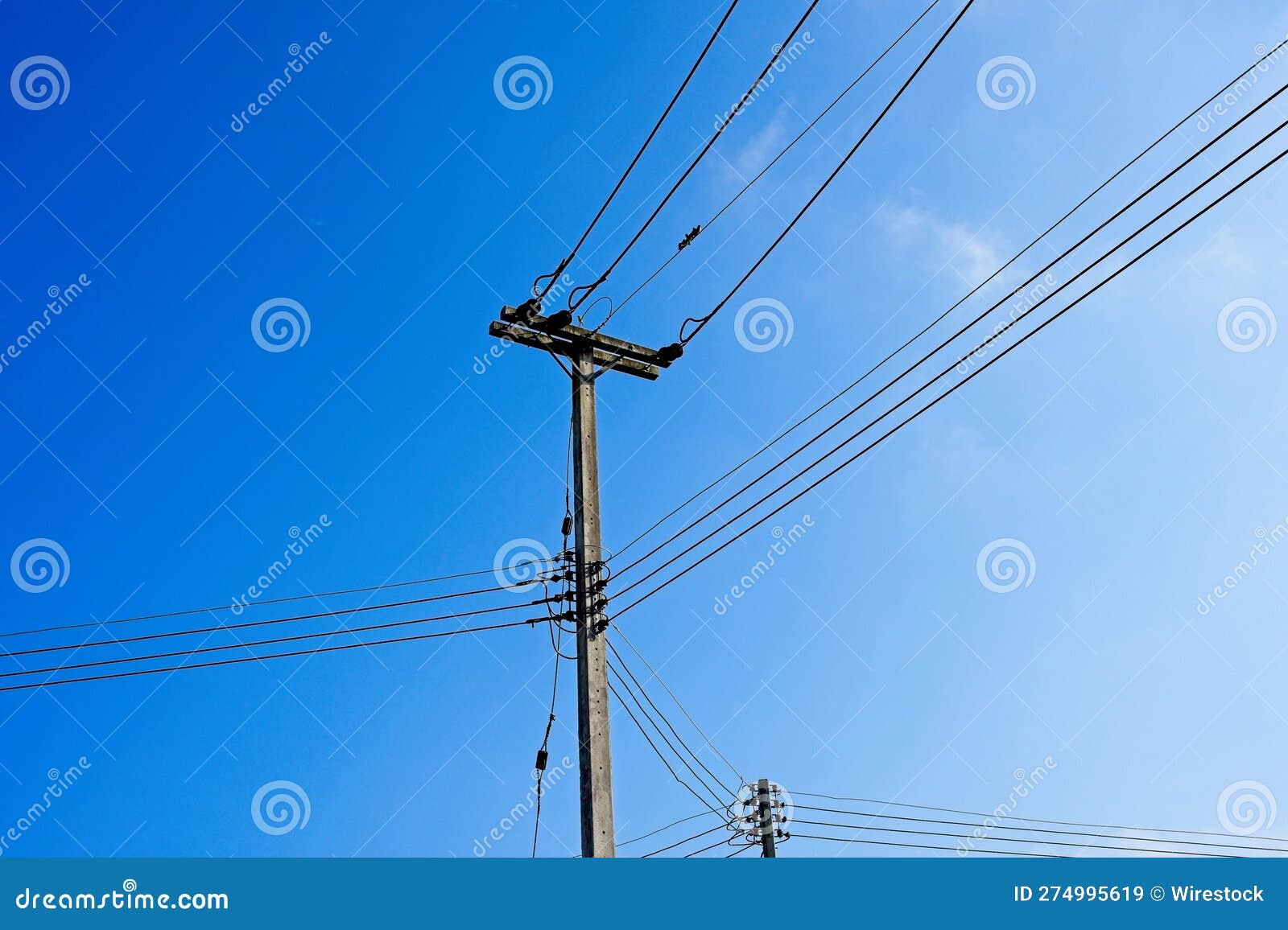 An Overhead Electrical Line With A Transformer Stock Photo