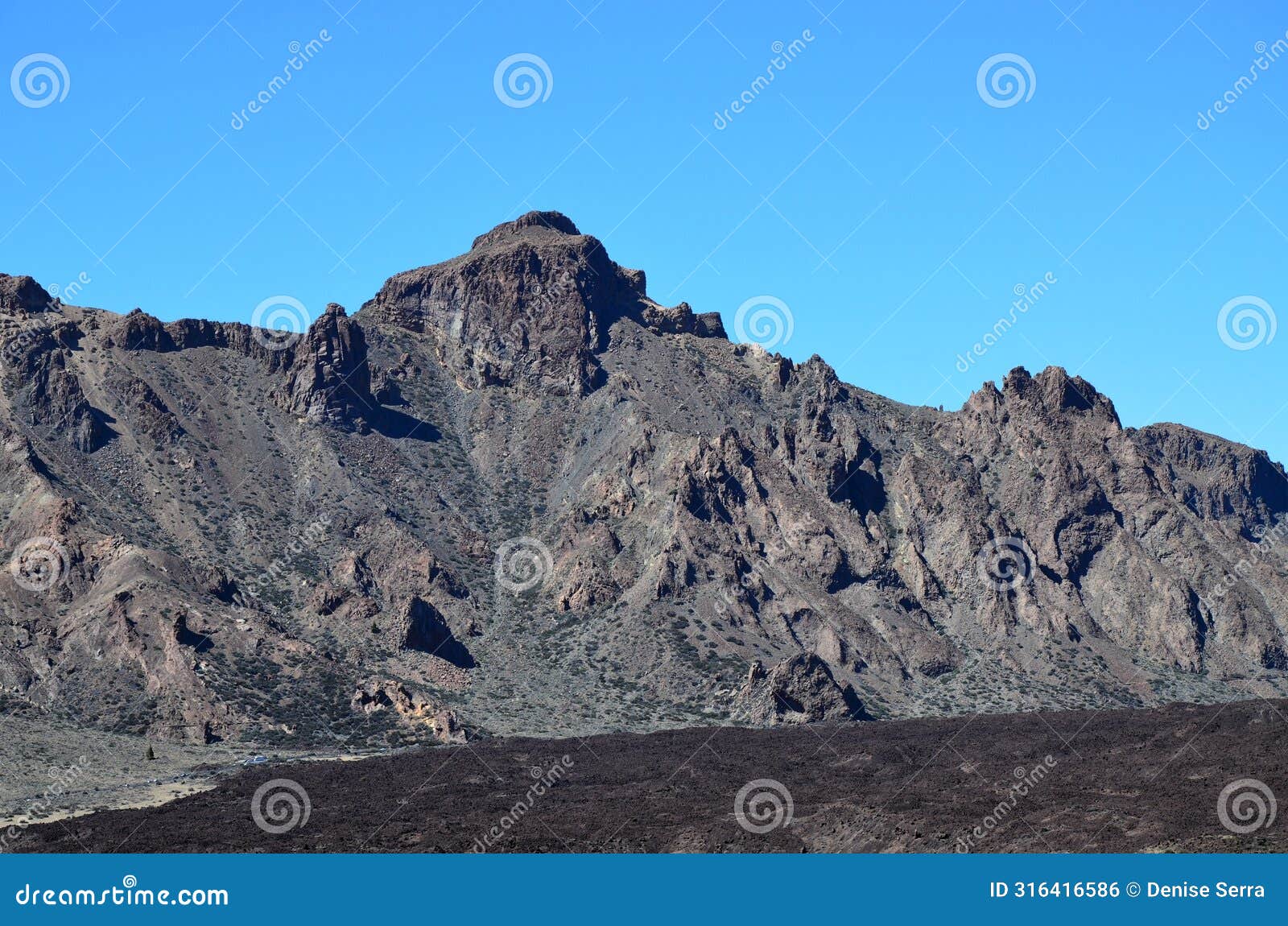 scenic view of volcanic rock formations in desert during sunny day, teide national park, tenerife