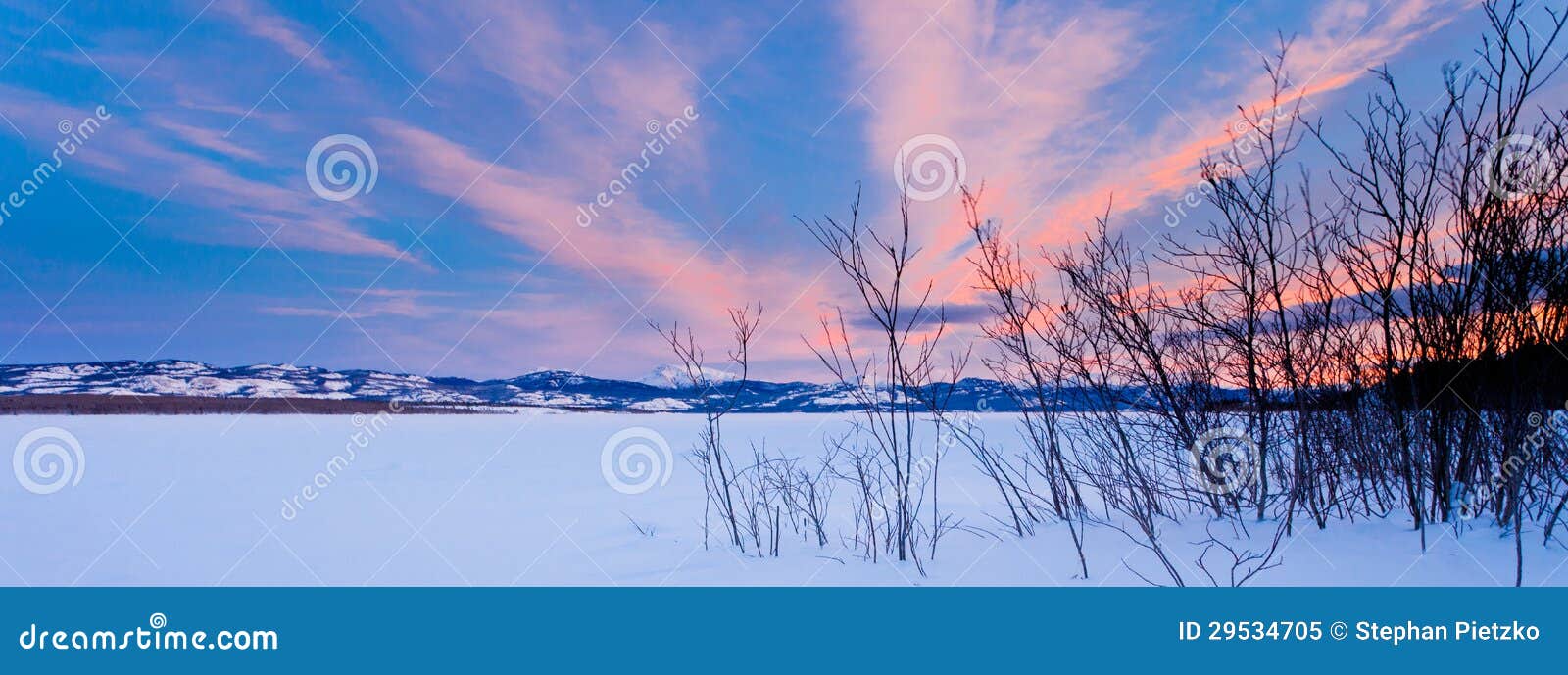 scenic winter at frozen lake laberge yukon canada