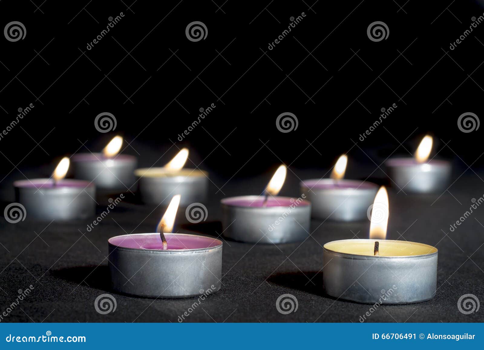 scented candles of different fragrances, on black