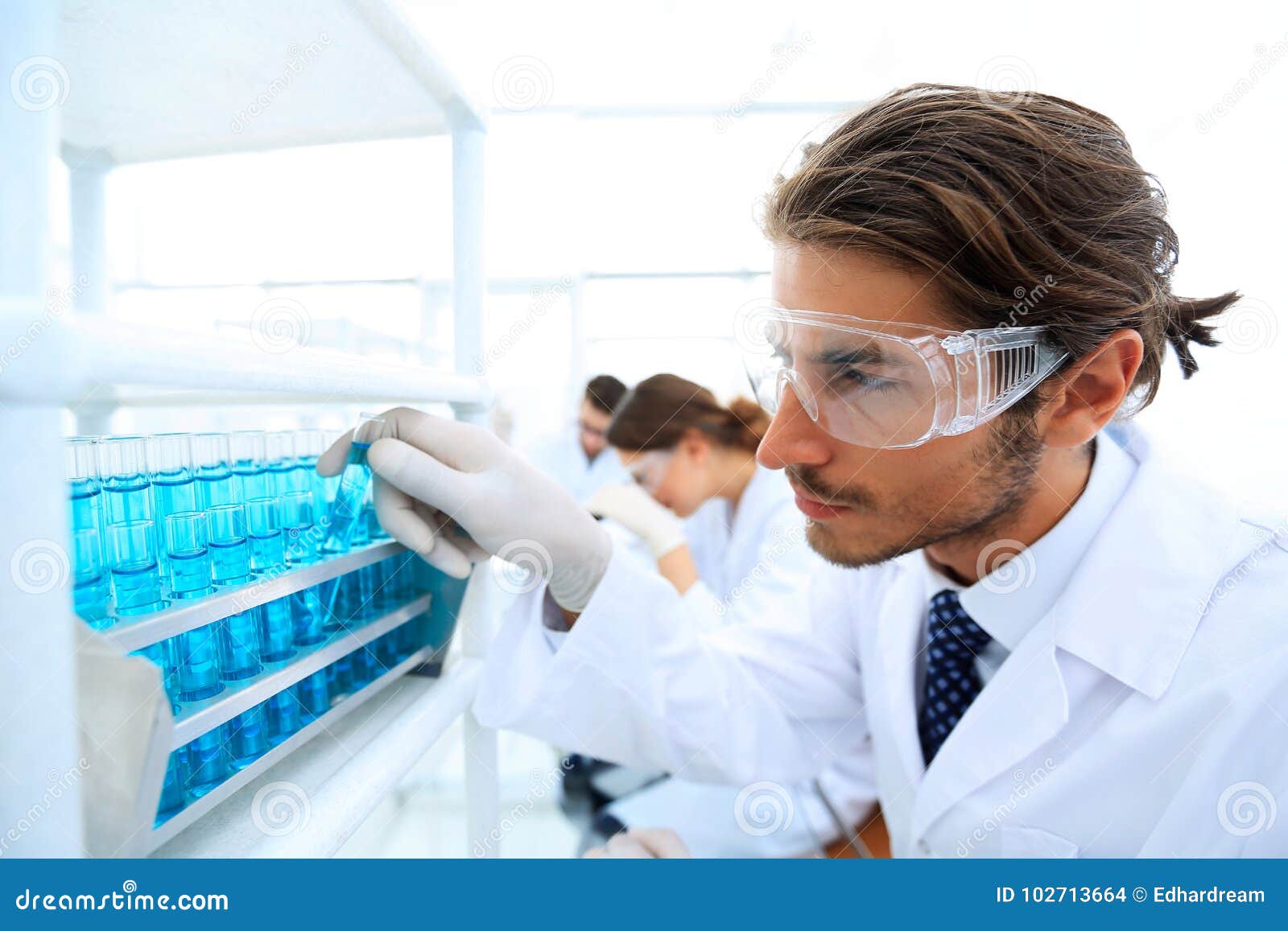 Portrait Of Man Wearing Lab Coat And Safety Goggles In Factory — Standing,  Male Stock Photo #263847826