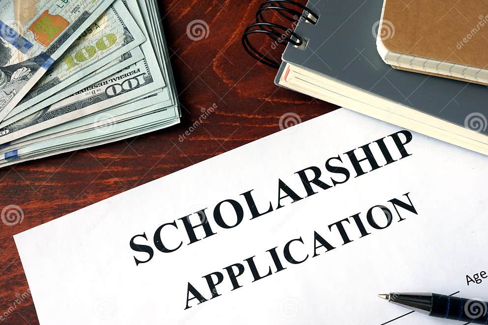 Scholarship Application. Scholarship Application on a table and dollars.