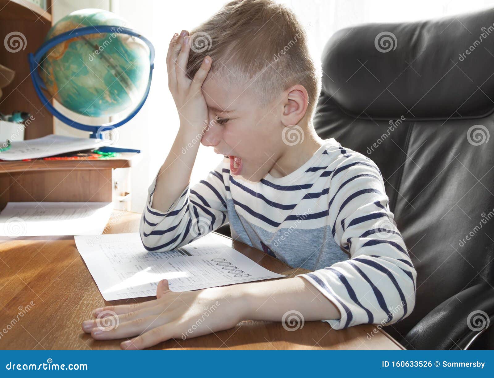 boy crying doing homework