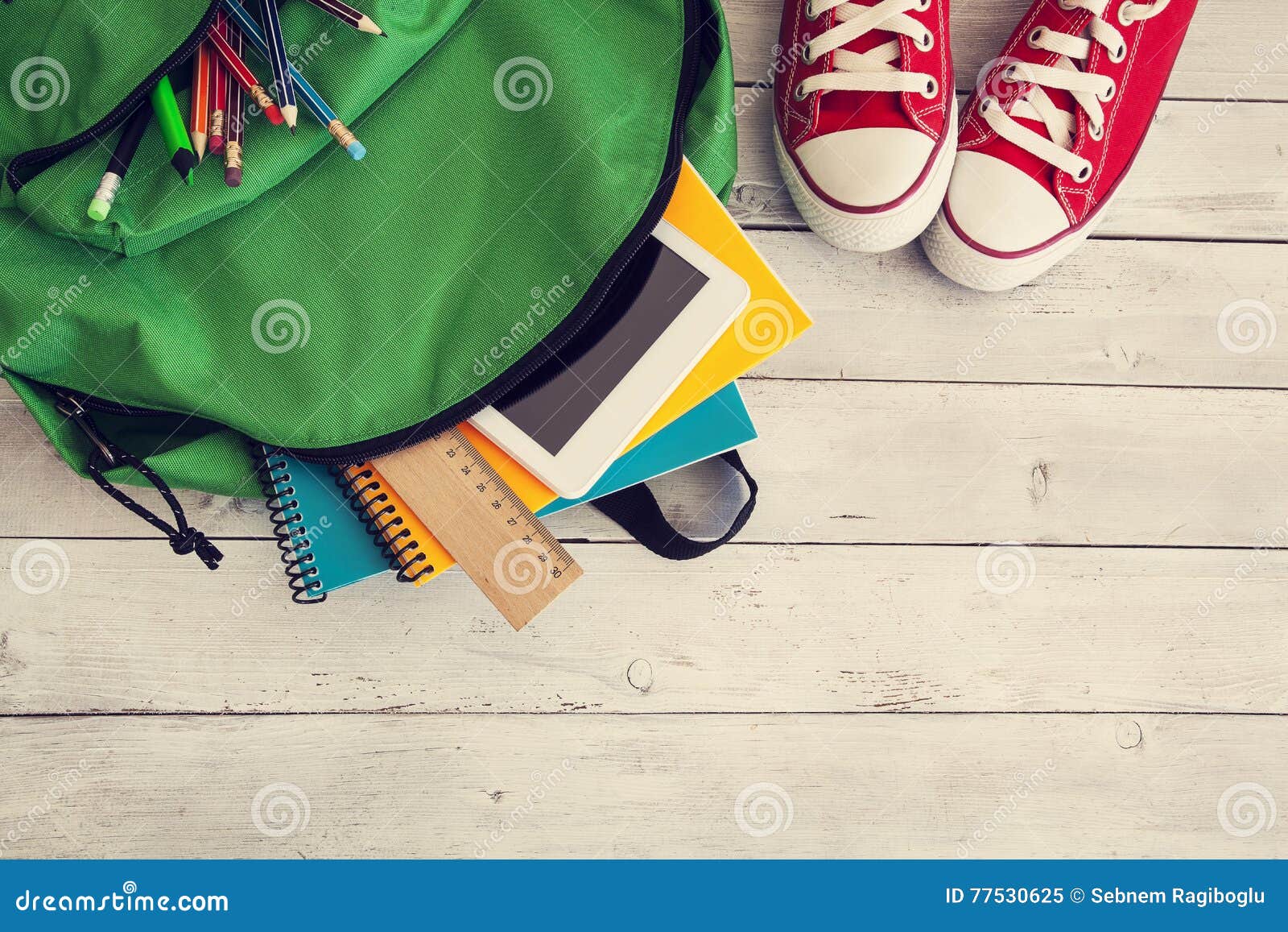 school backpack on wooden background