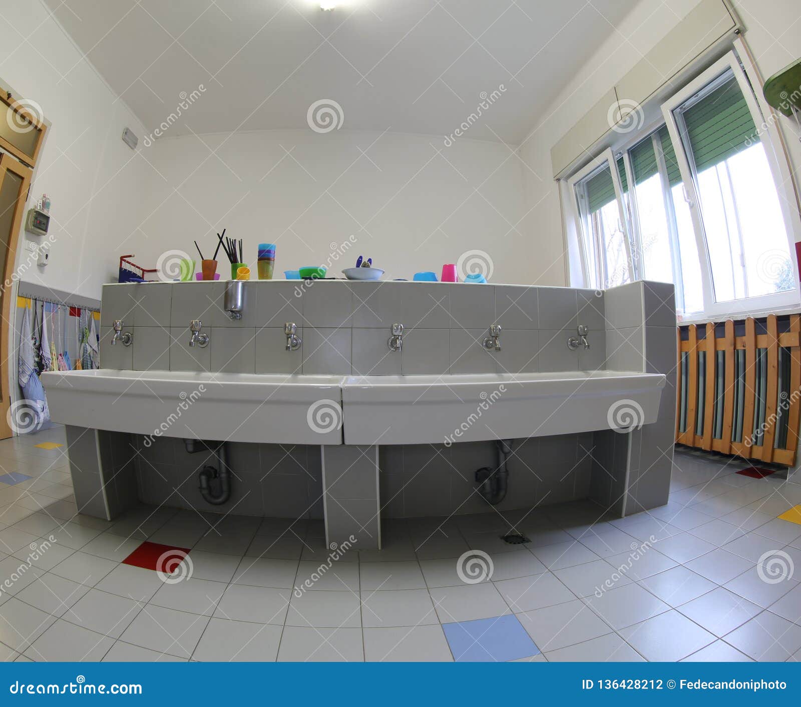 School Bathroom With Large Ceramic Sink Without Children