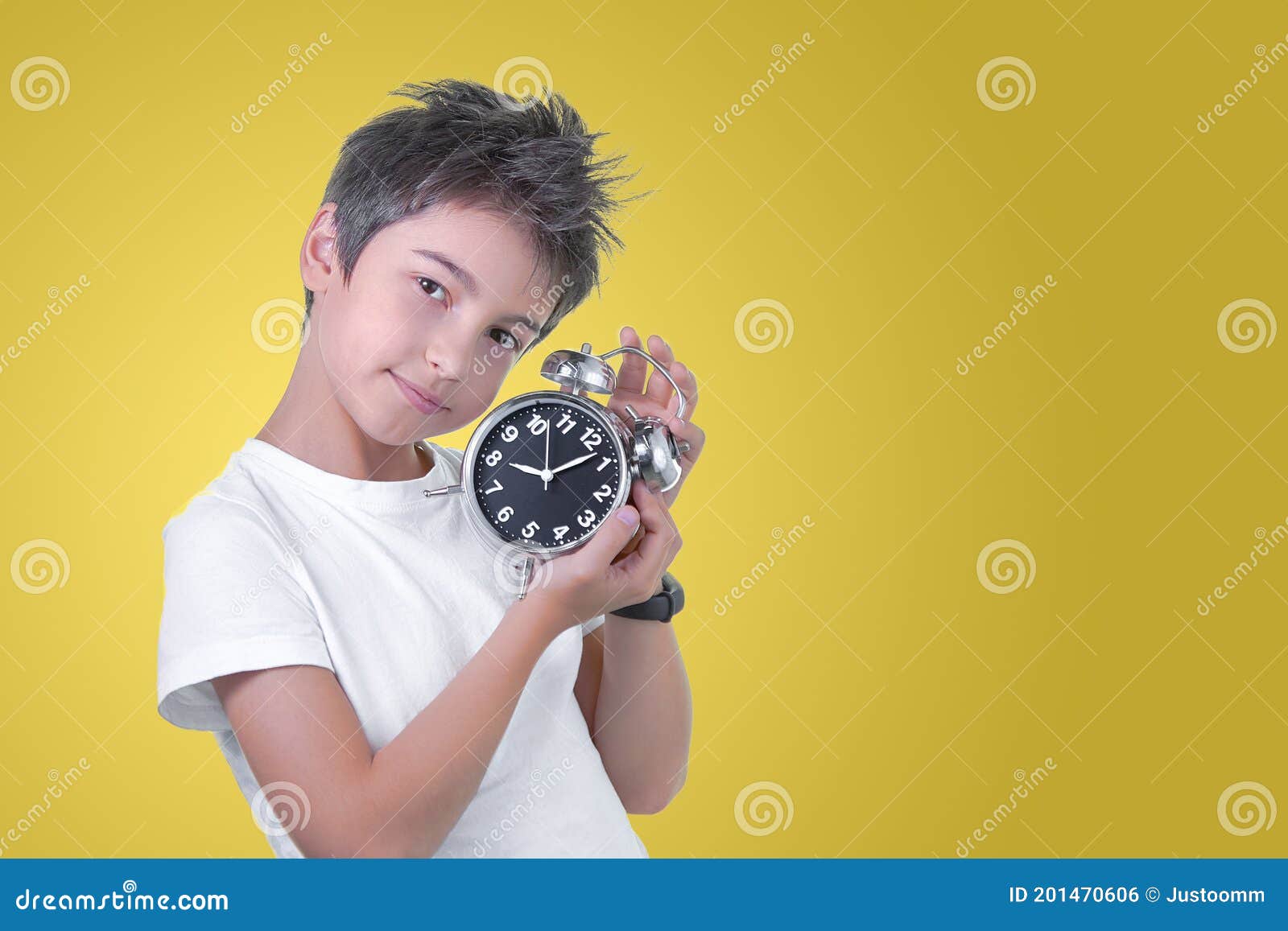 School Boy with Alarm Clock in Hands Isolated on Yellow. Time To Go