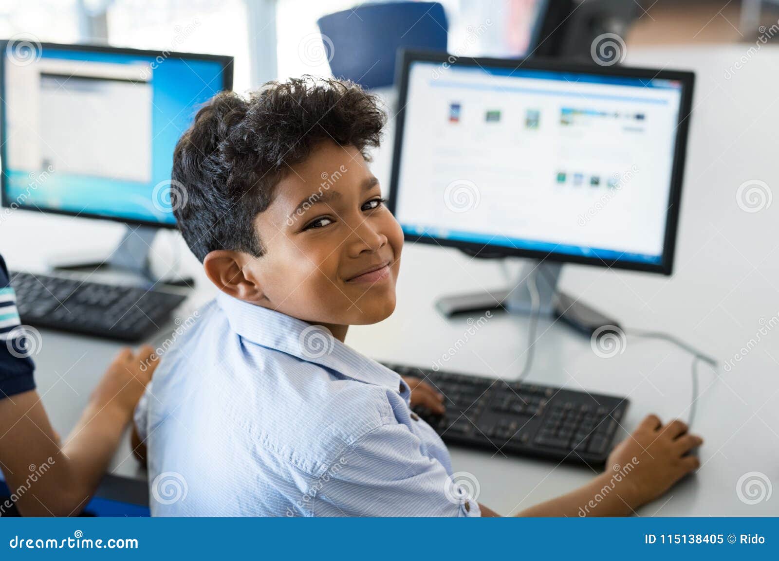 school boy using computer