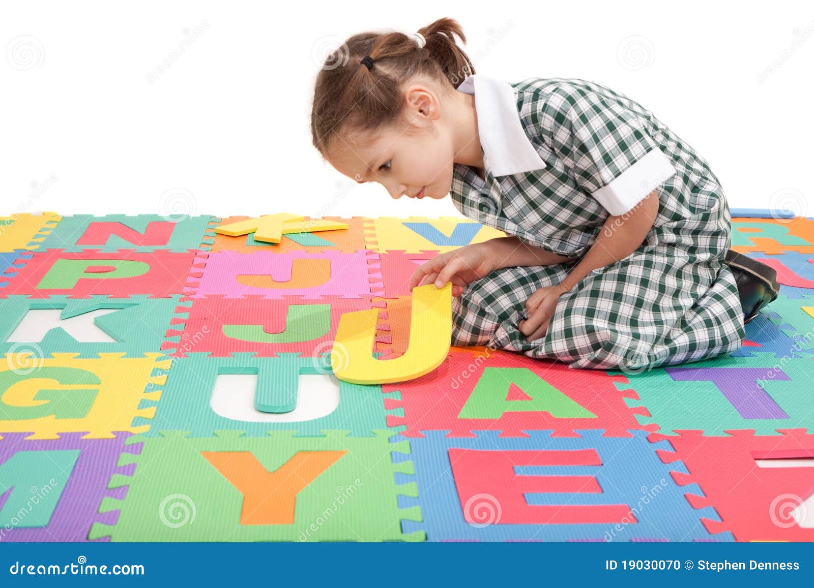 School Girl in Uniform and Alphabet Letter Puzzle Stock Photo Image