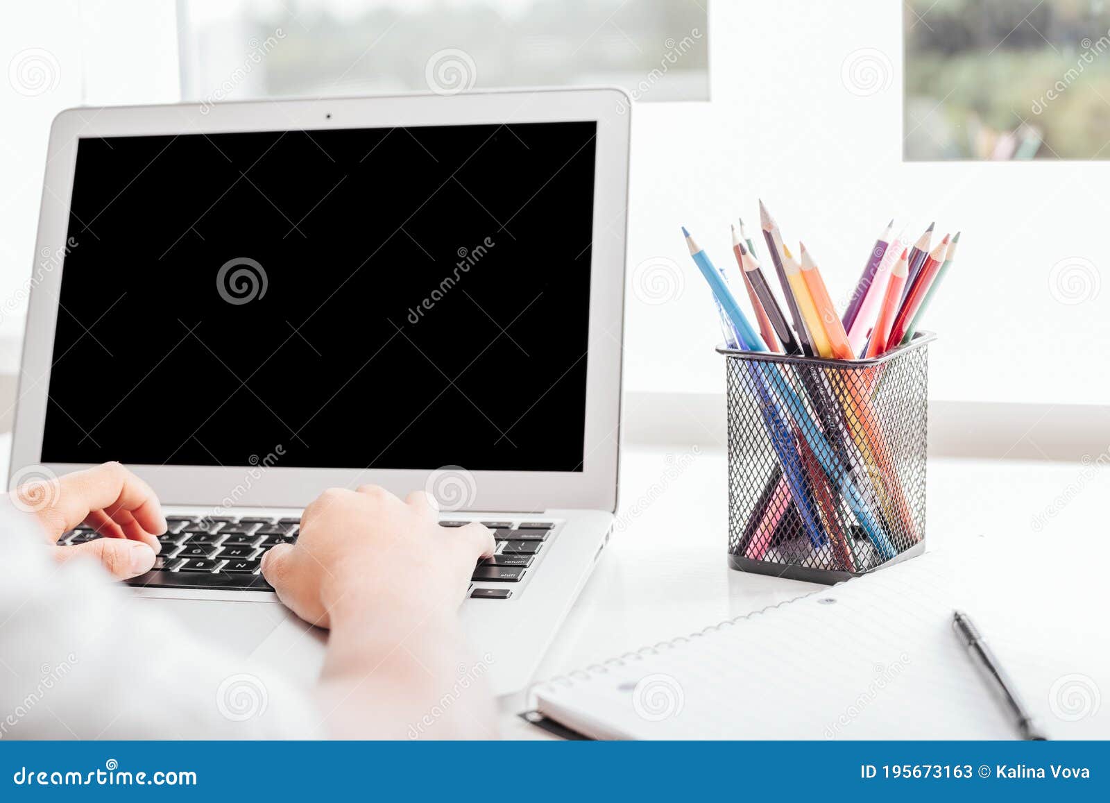 A School at Home through Online Homeschooling. the Child is Sitting at