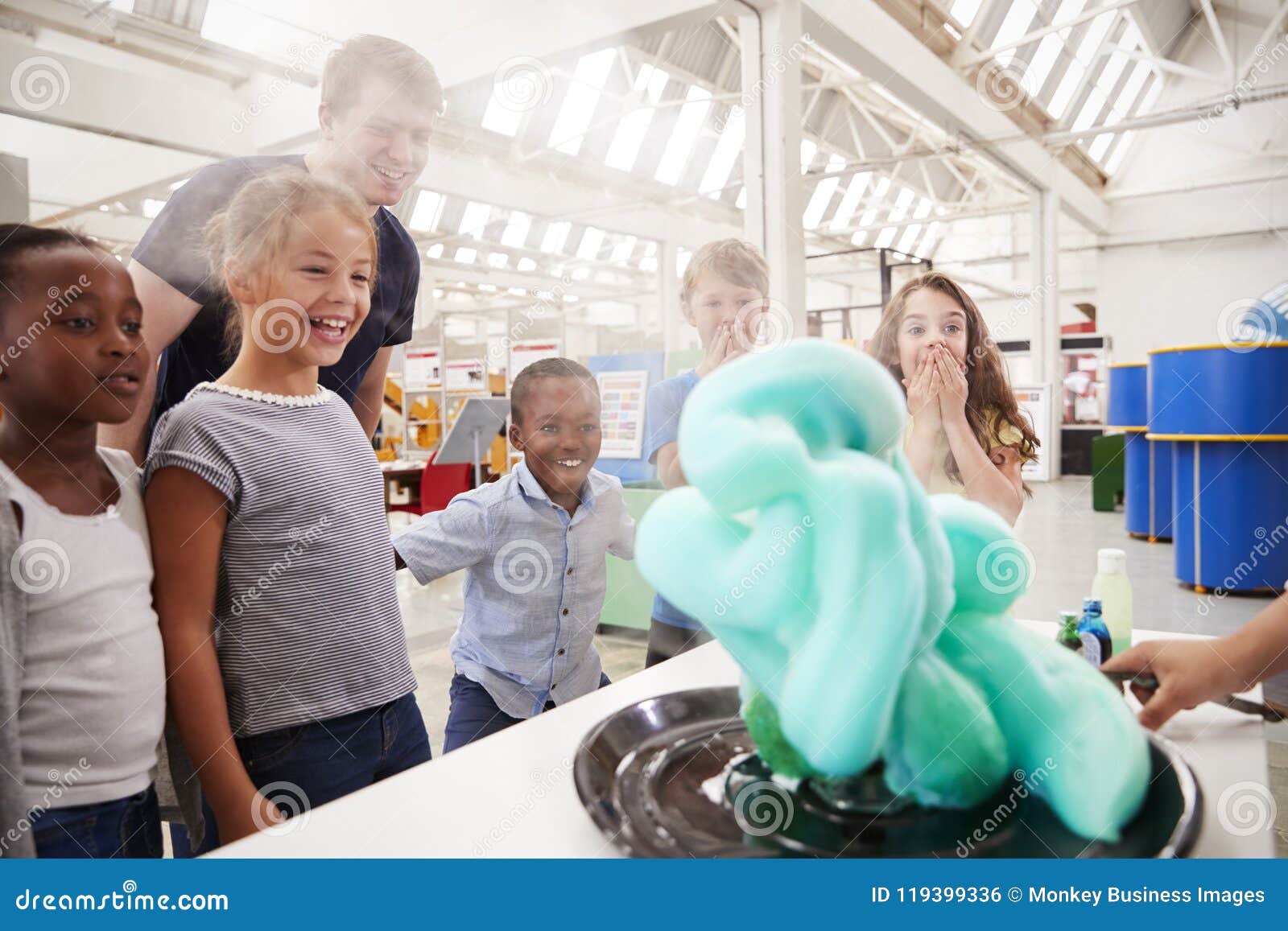 School Kids Watching an Experiment at a Science Centre Stock Photo