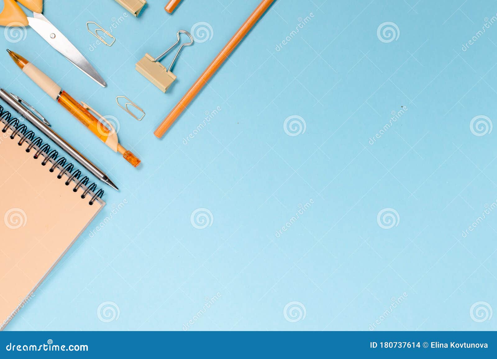 school stationary , back to school concept colorfull flatlay. pencils,notepad, ruler scissors and paper clips.top horizontal view