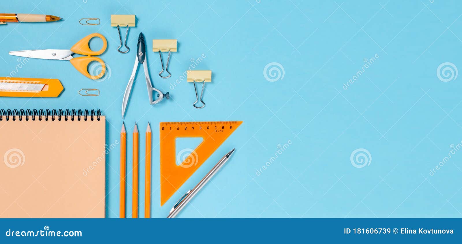 school stationary , back to school concept colorfull flatlay. pencils,notepad, ruler scissors and paper clips.top horizontal view