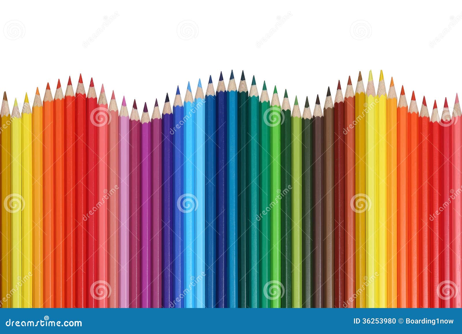 school supplies colored pencils forming a wave