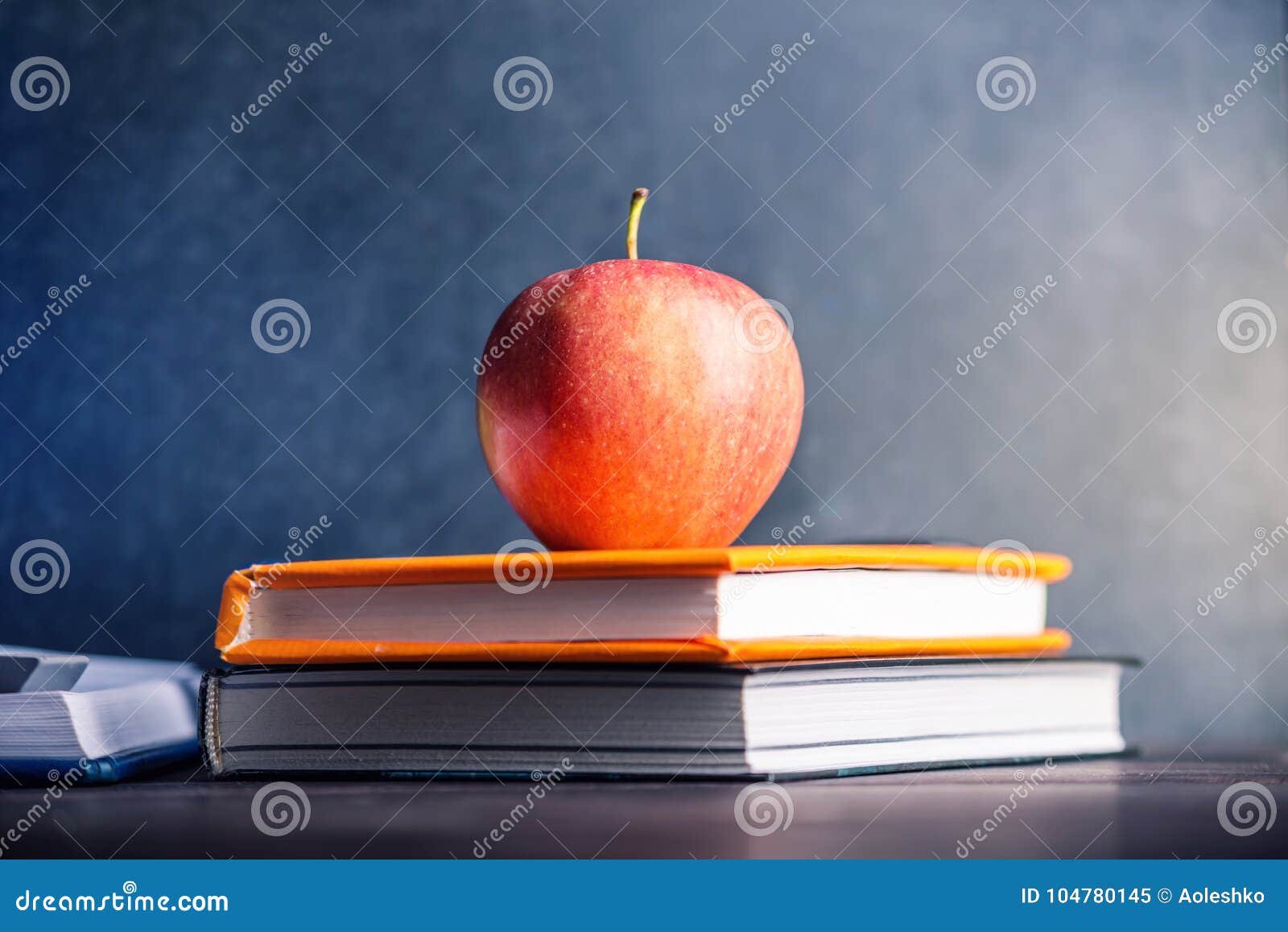 School Supplies on the Table. Books and Apples is a Collection of the ...