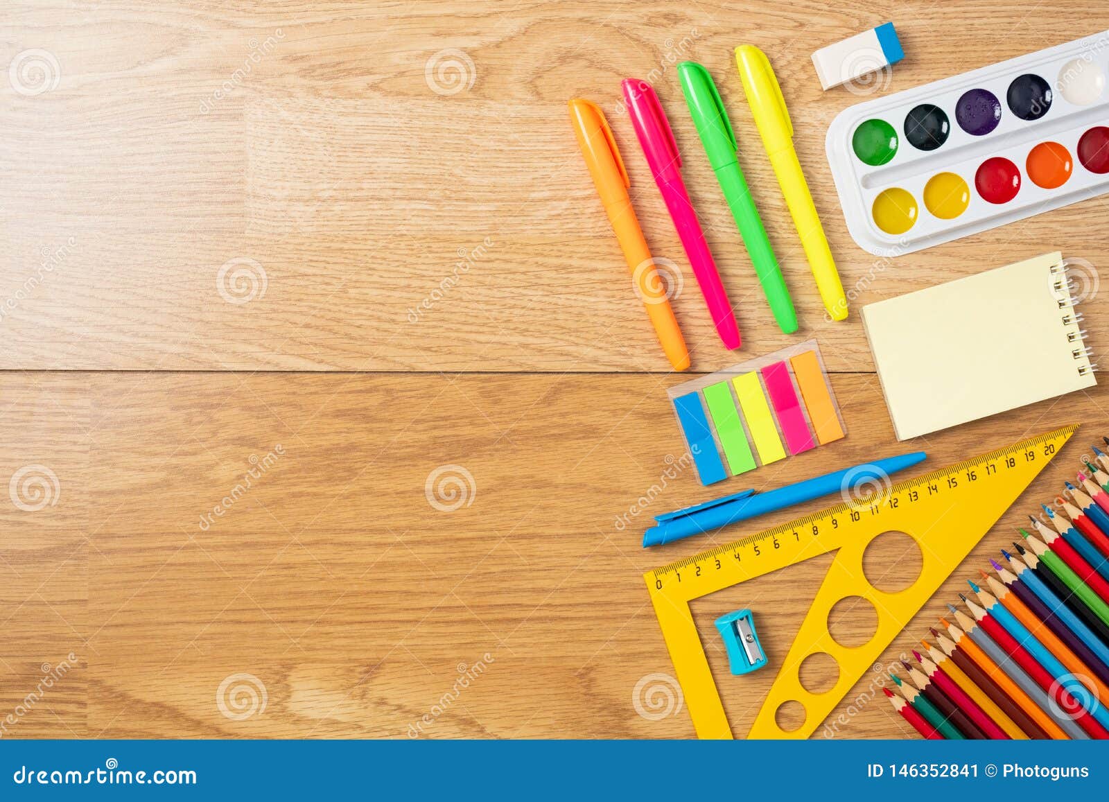 School supplies on wooden desk. Kid creativity flat lay Stock Photo by rawf8