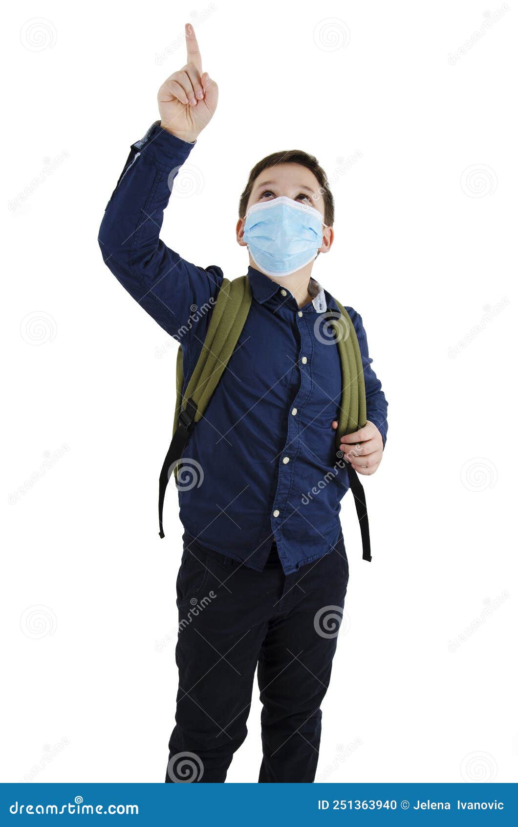 Schoolboy with Backpack Pointing Up and Wearing a Protective Face Mask ...