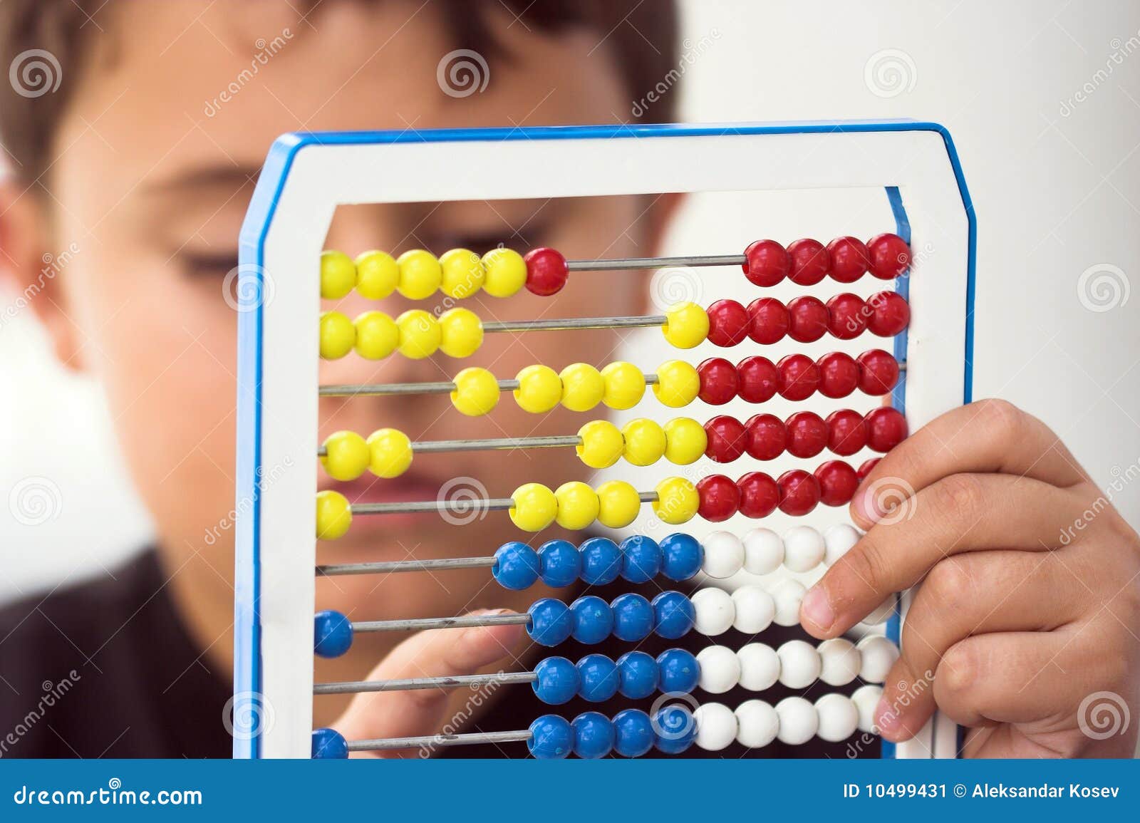 schoolboy calculate with abacus