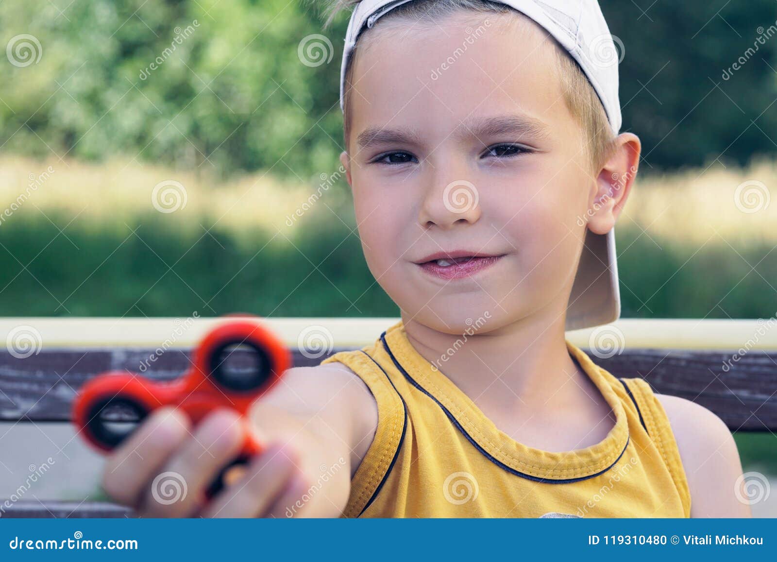 Schoolboy Holding Popular Fidget Spinner Toy Close Up Portrait