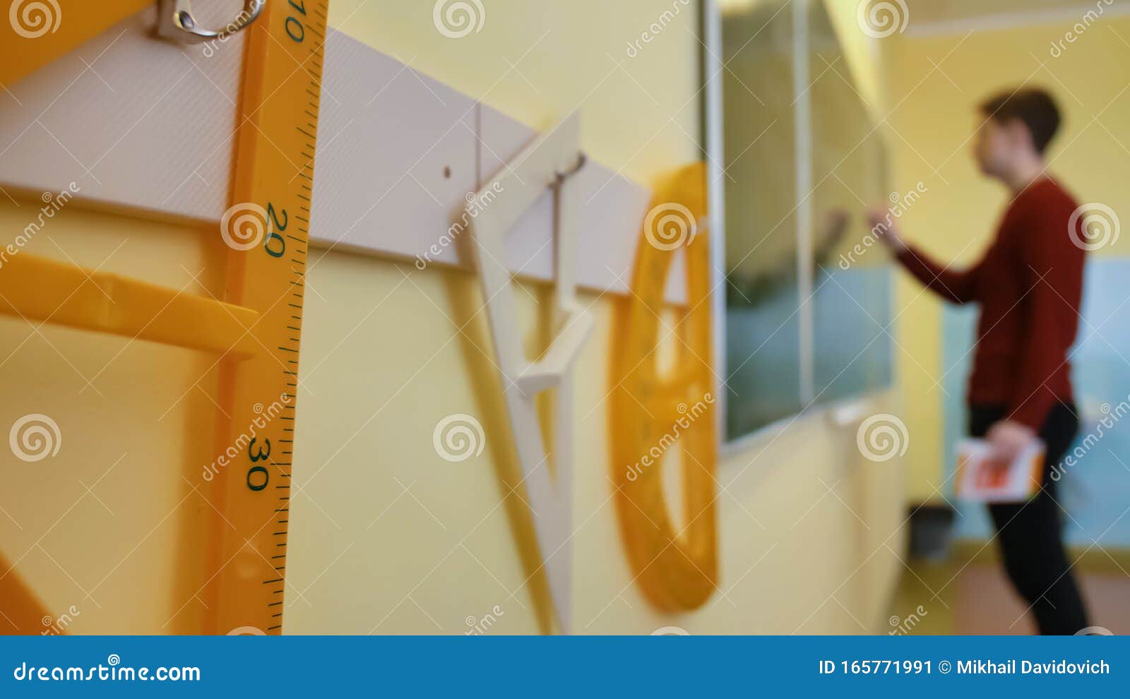 A Schoolboy Writes on the Blackboard during a Geometry Lesson. Geometry