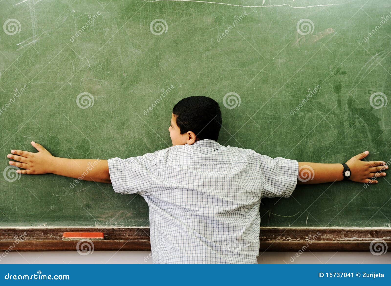 schoolchild hugging board